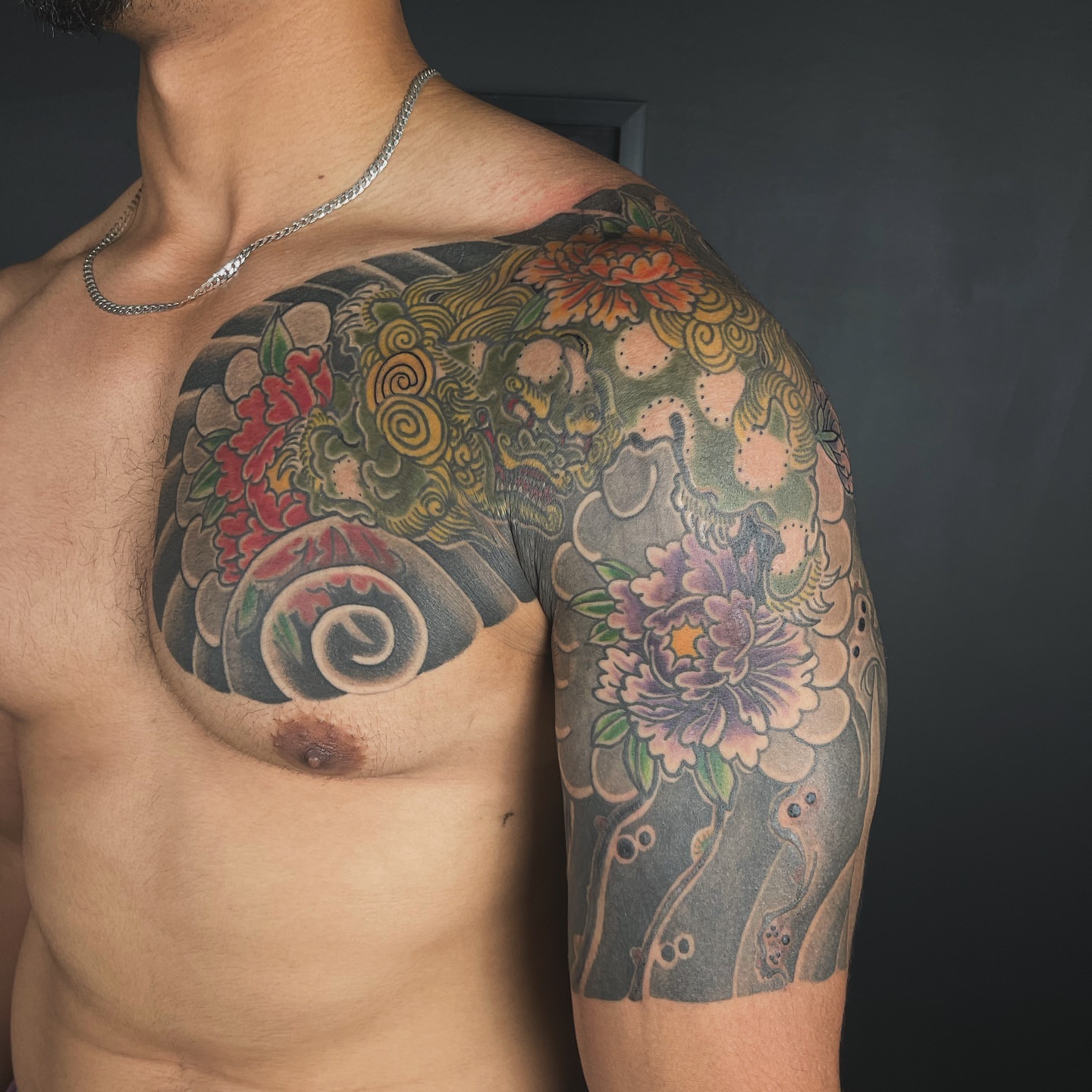 Dragon and flowers japanese irezumi tattoo on the shoulder by Zack Yang, Houston, Texas