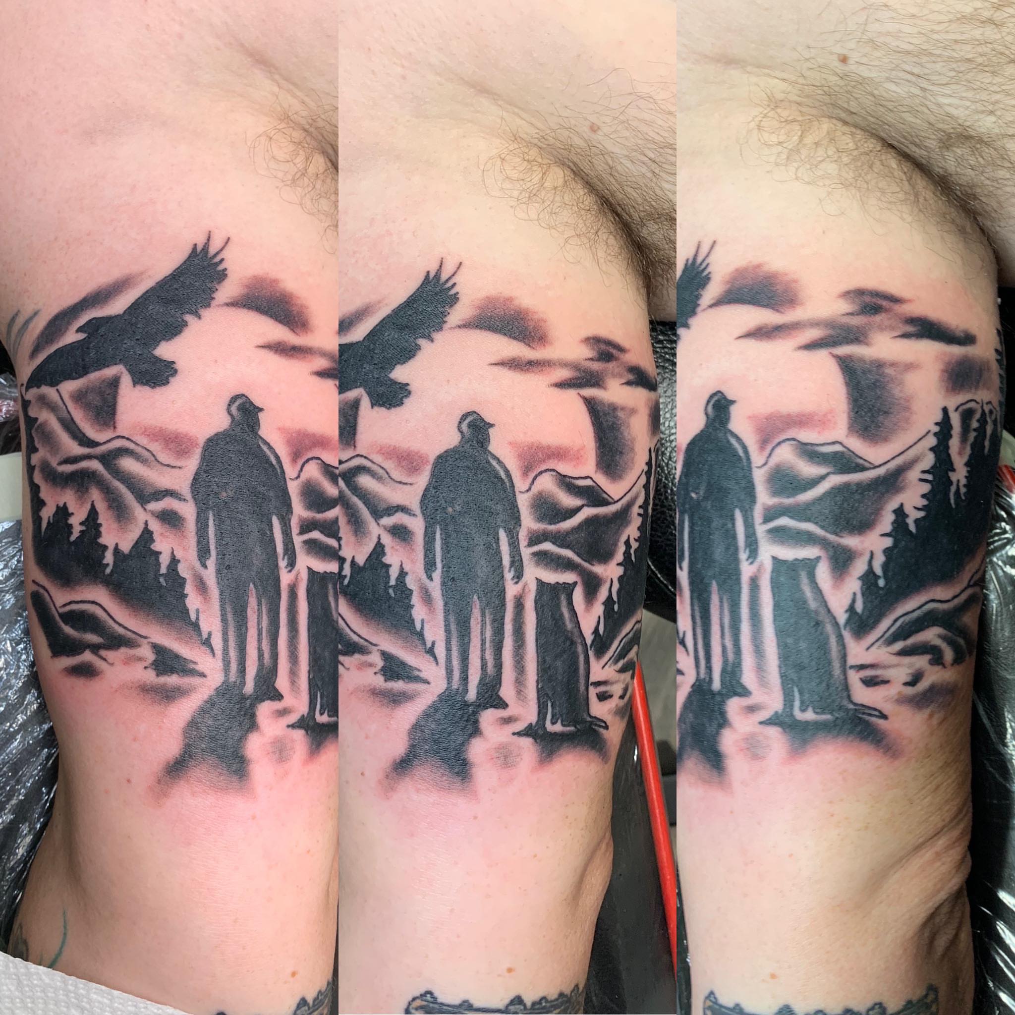 Silhouettes in landscape black and grey tattoo on the forearm by @goat76