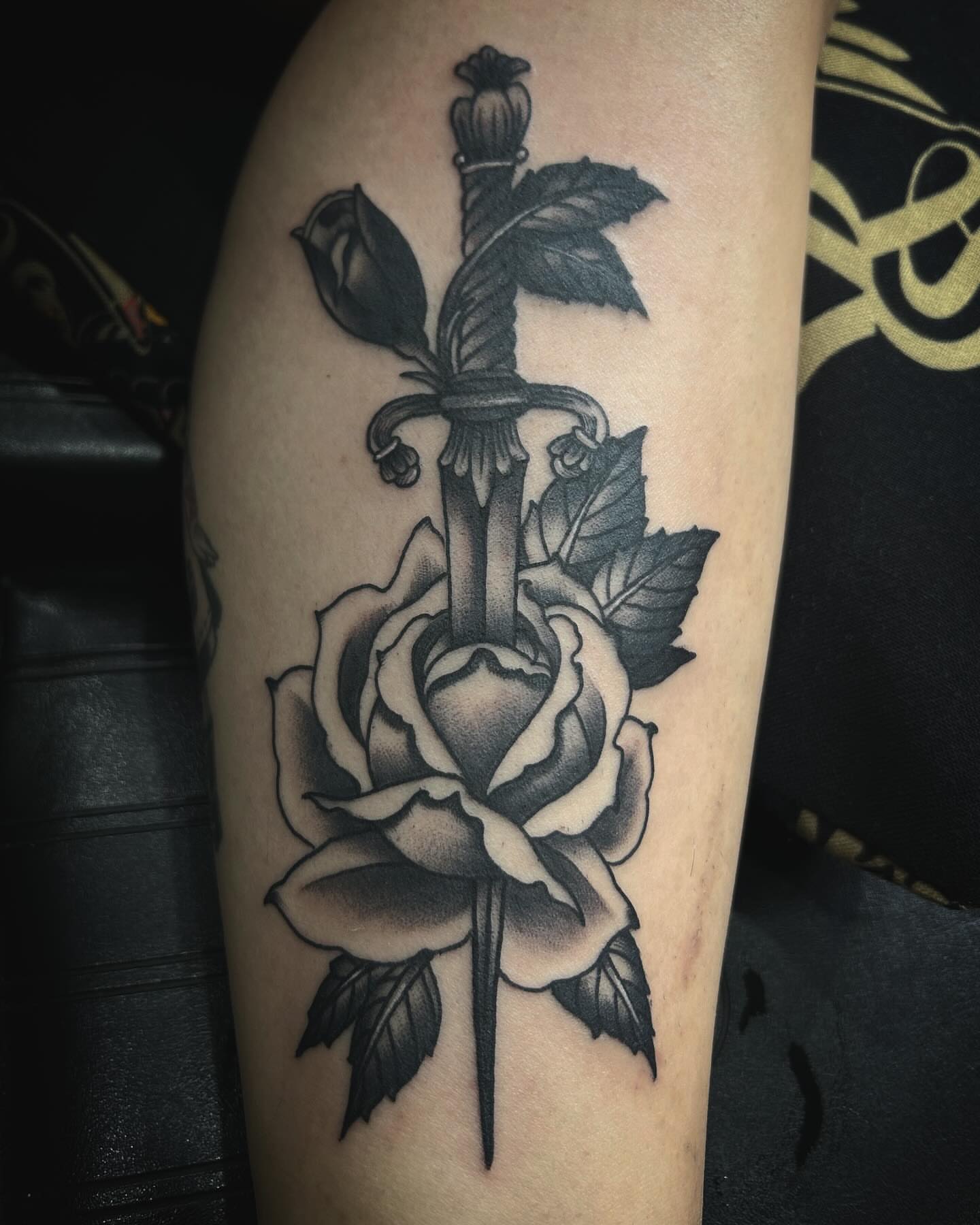 Sword and rose black and grey tattoo on the forearm by Samantha C, Bremerton, Washington