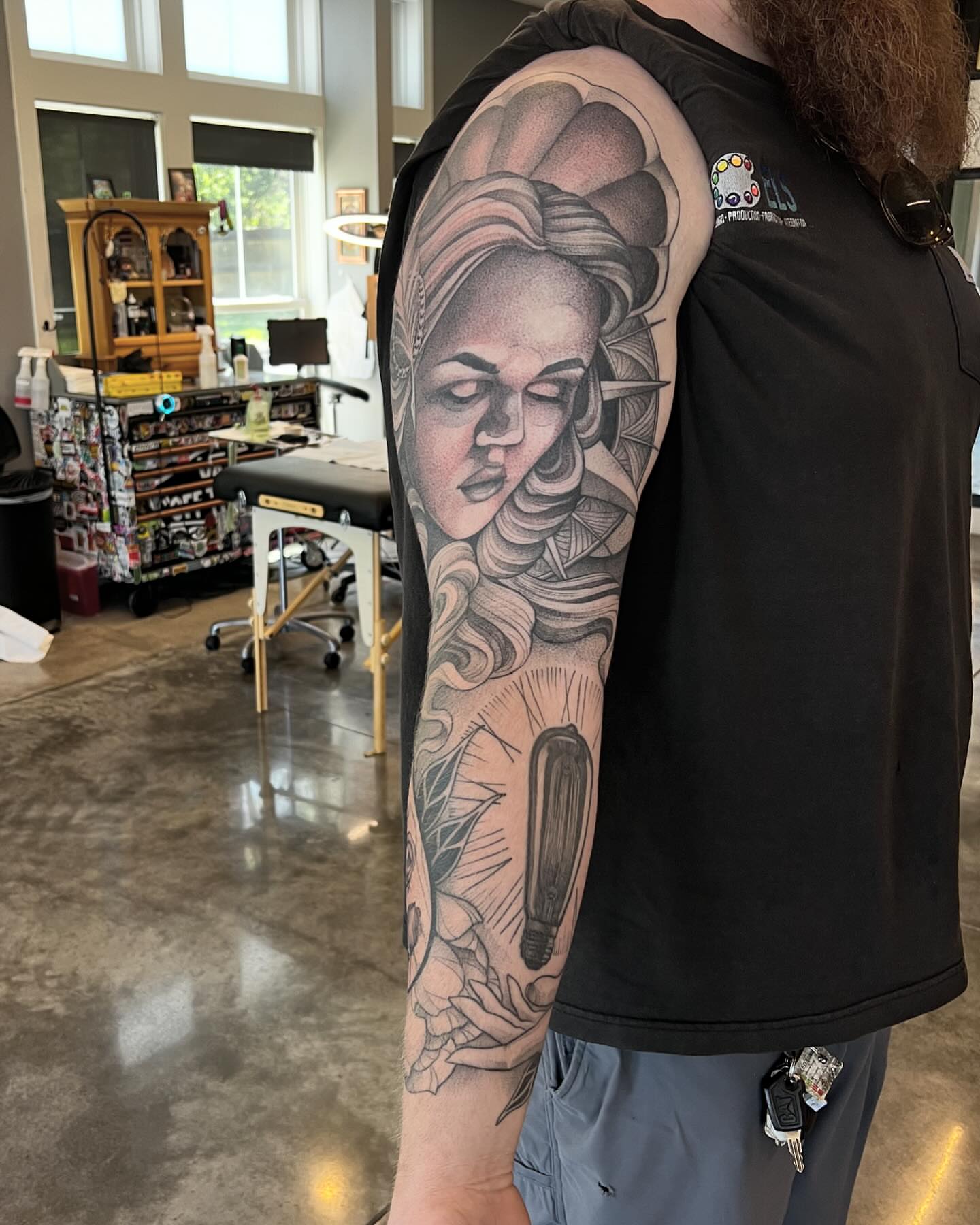 Woman's face realism tattoo on the forearm by Will Campbell