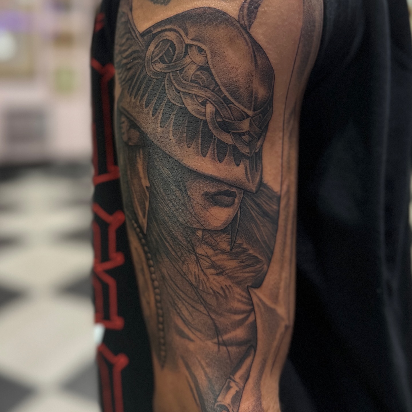 Helmeted warrior realism tattoo on the forearm by Zachary Kaufhold