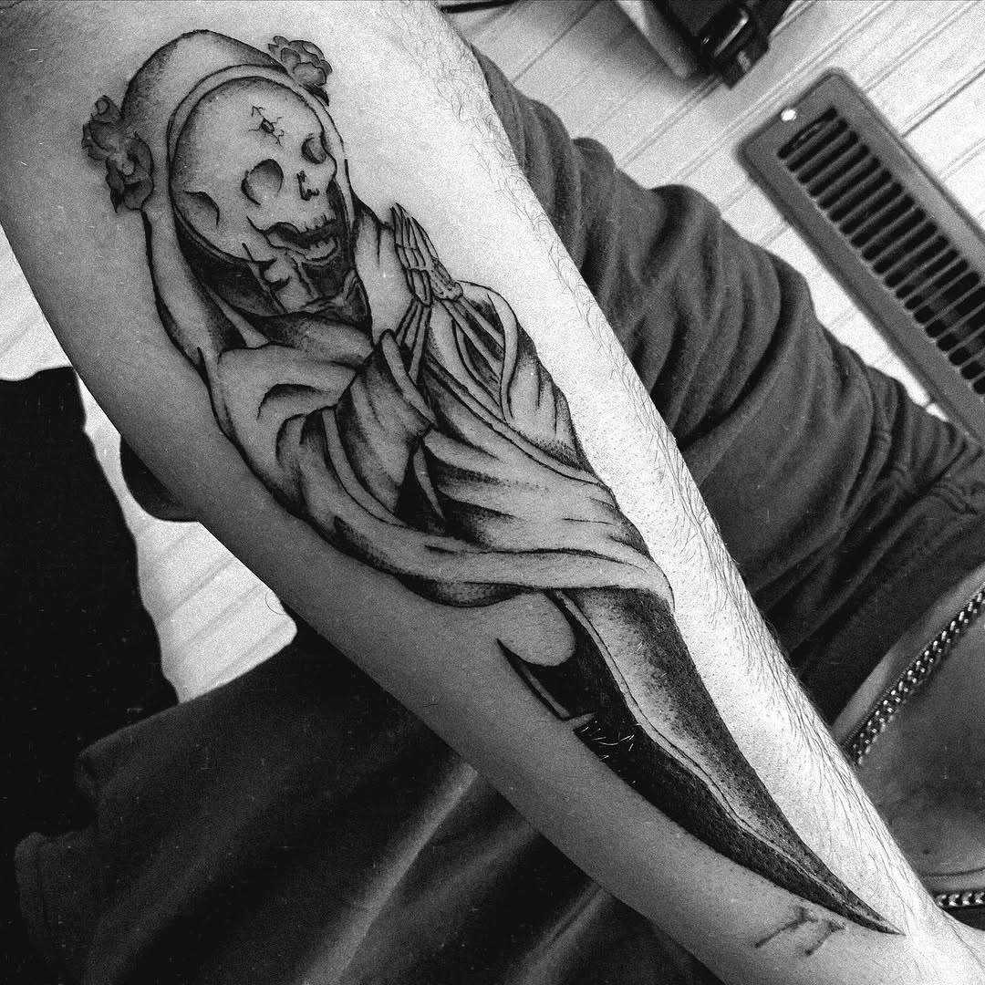 Grim reaper praying with a scythe realism tattoo on the forearm by Bear