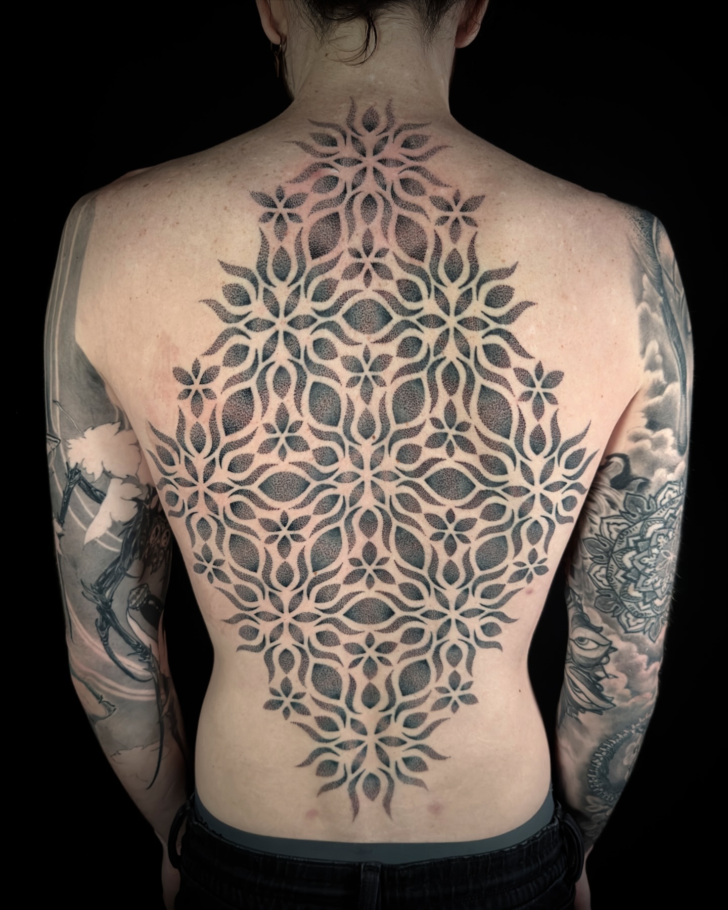 Geometric pattern geometric tattoo on the back by Chelsey