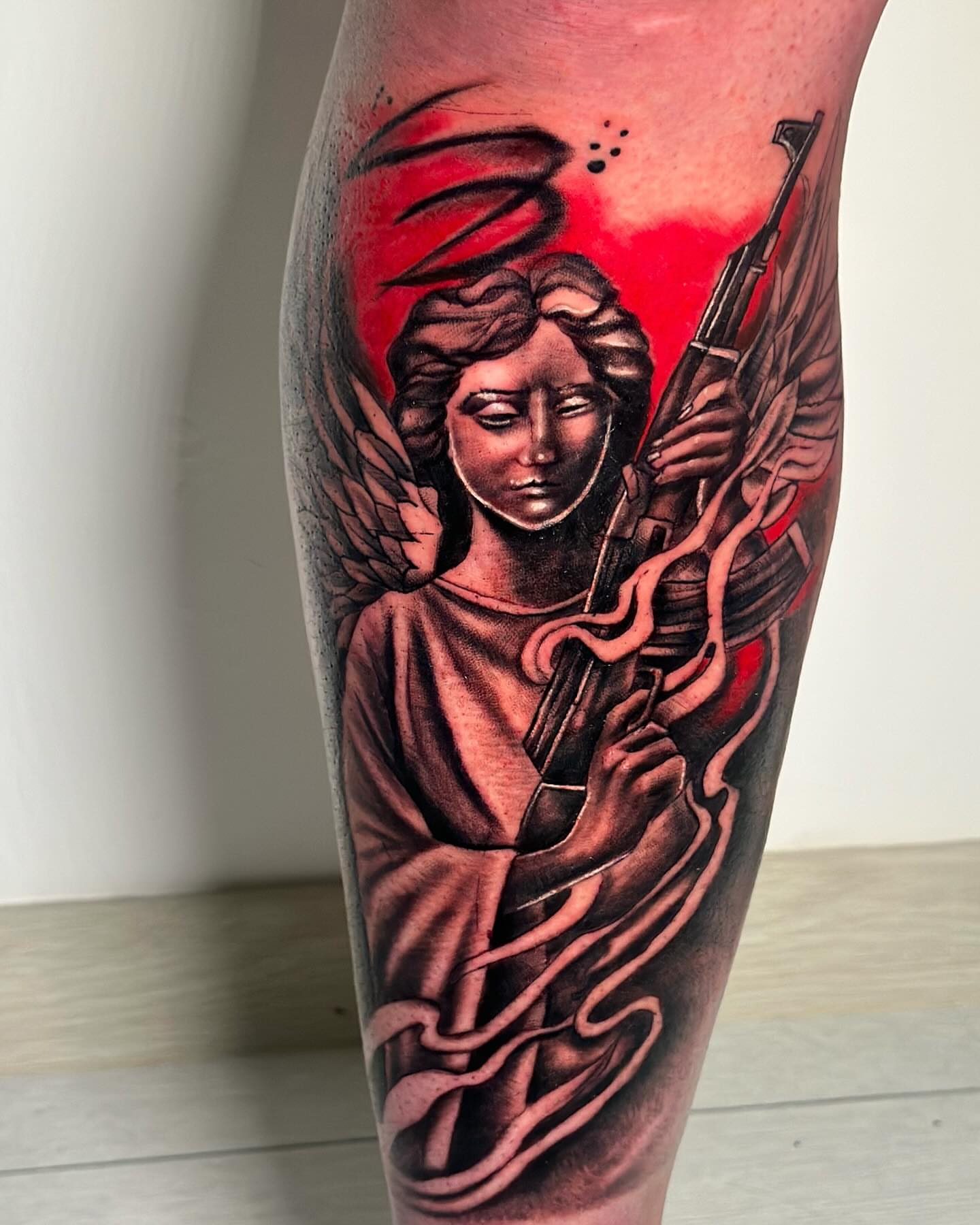 Angel with rifle realism tattoo on the forearm by Anghel Patricia
