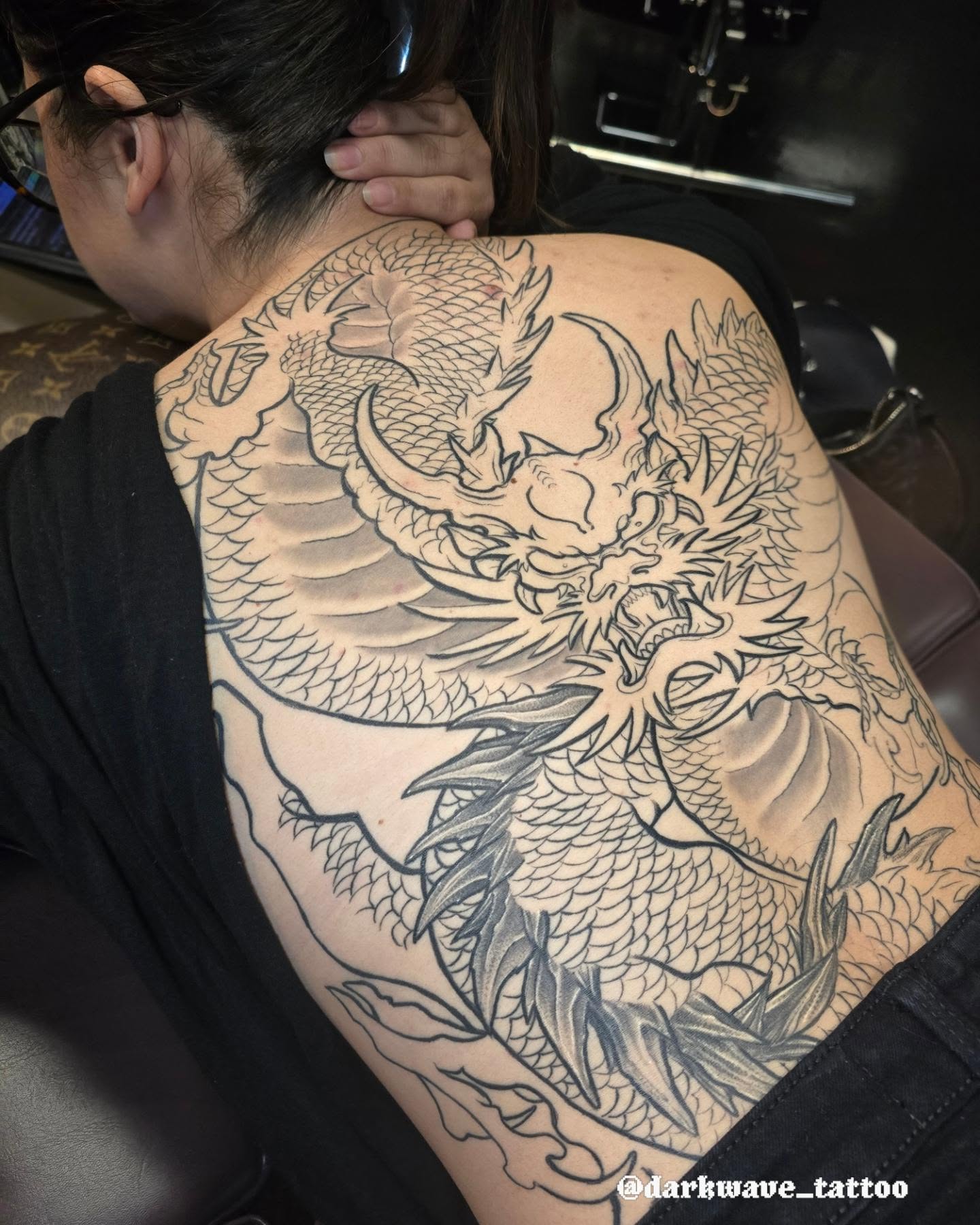 Dragon black and grey tattoo on the back by Barrett Handel