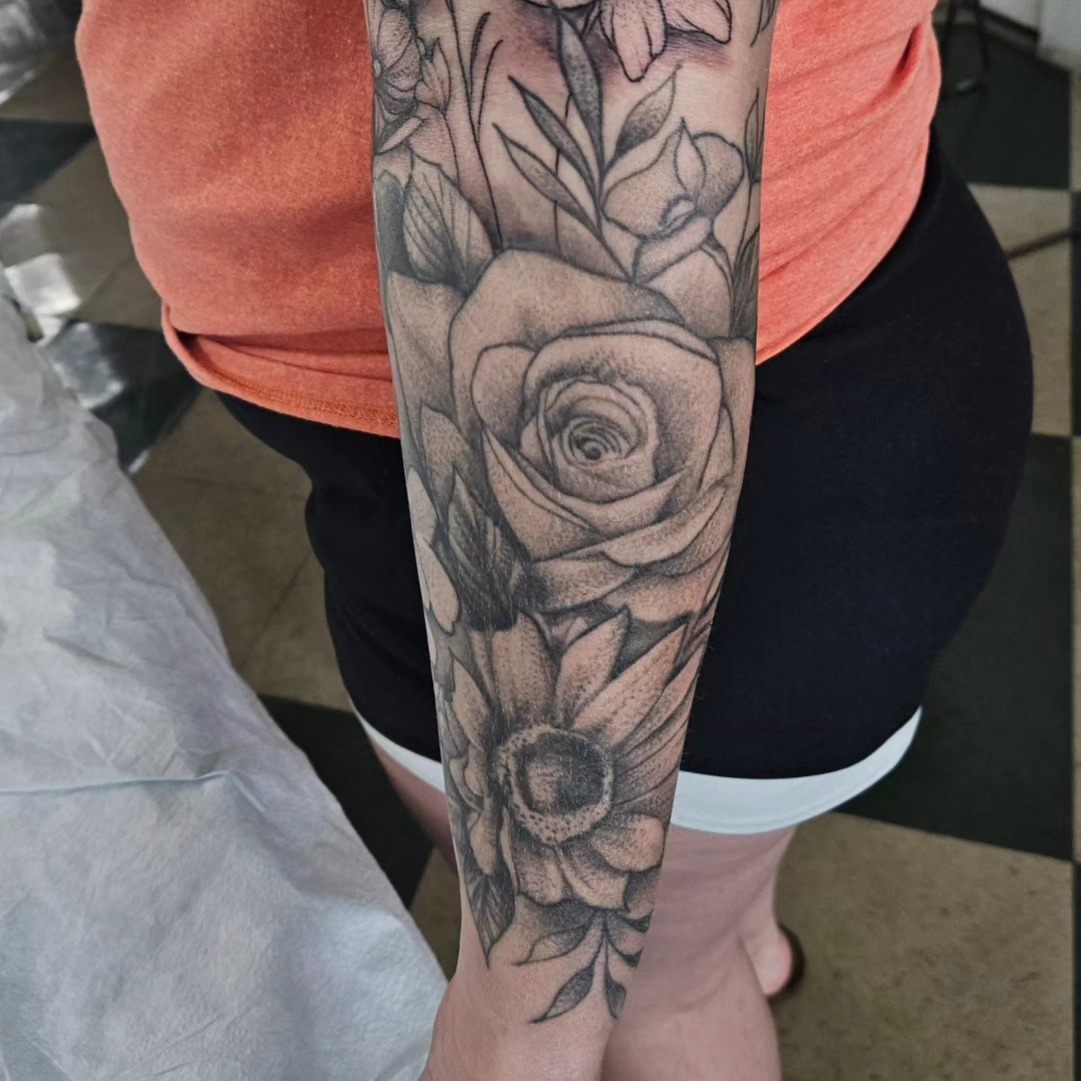 Floral bouquet dotwork tattoo on the forearm by David Nash, Evansville, Indiana