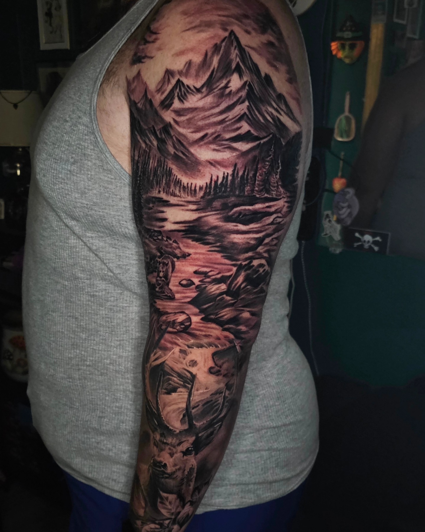 Mountain landscape realism tattoo on the upper arm by Christian Mulvey