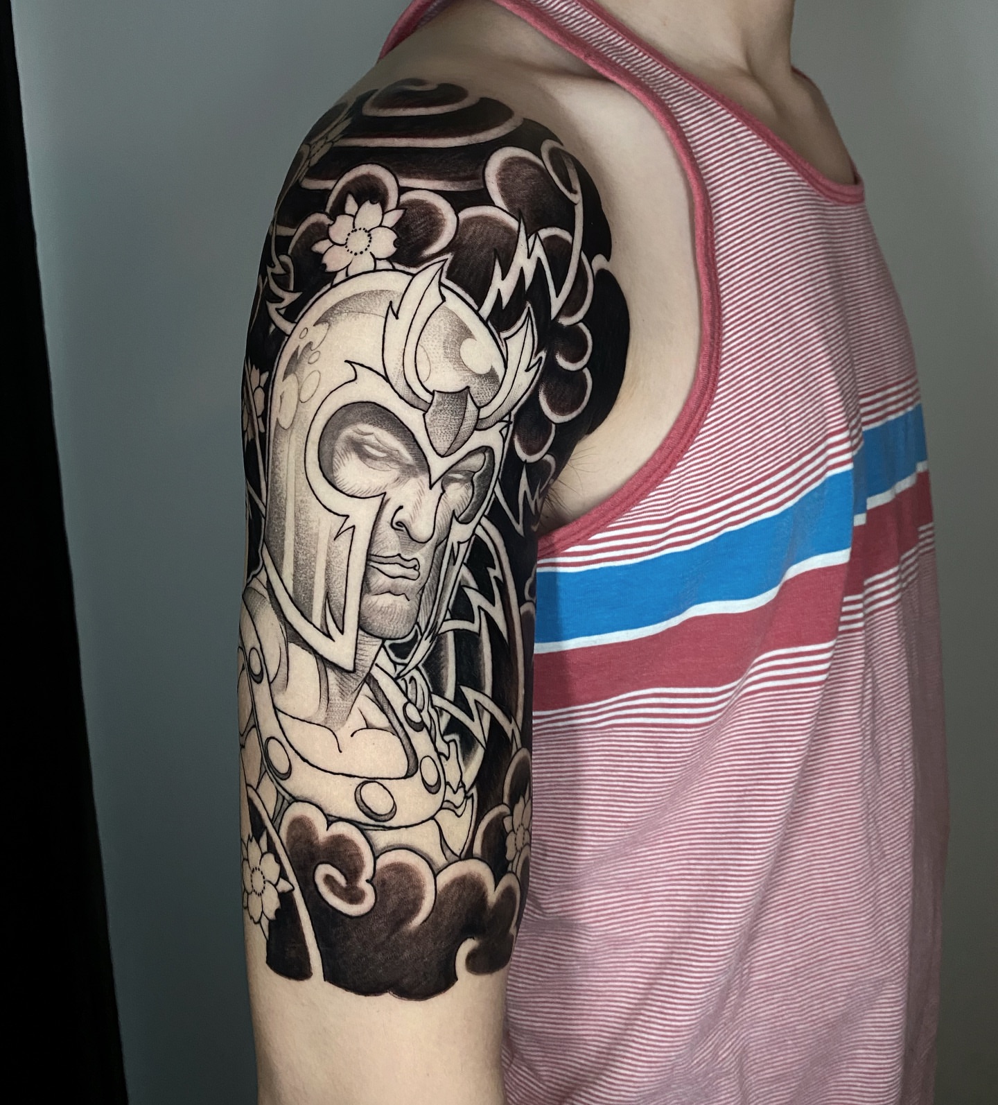 Warrior mask realism tattoo on the upper arm by H O R I H A N