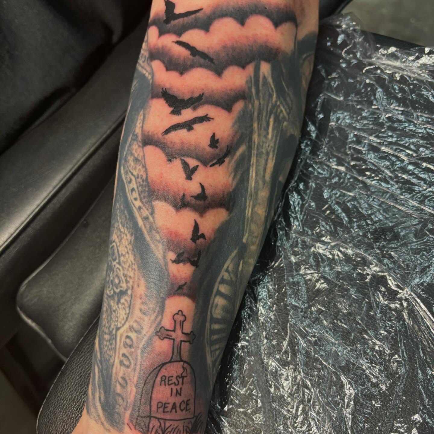 Graveyard scene realism tattoo on the forearm by Natalie Opal🪻🍎🫖