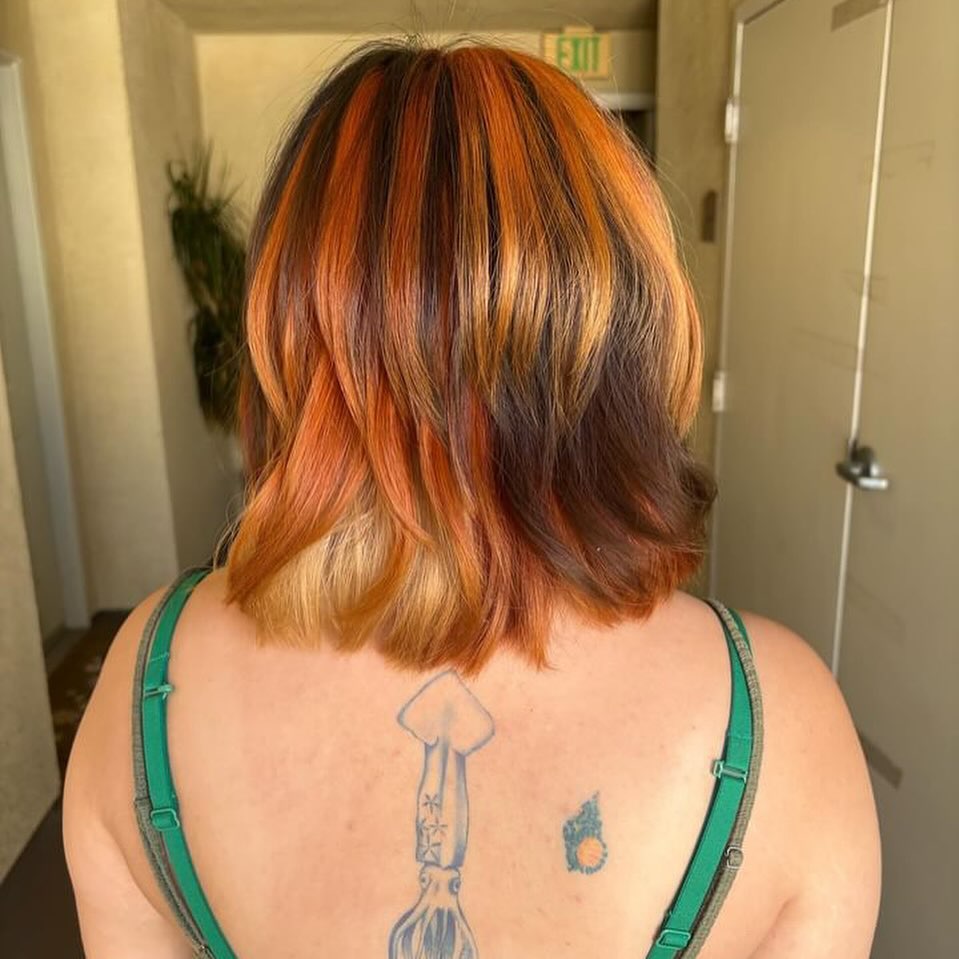 Squid and flame dotwork tattoo on the back by hana