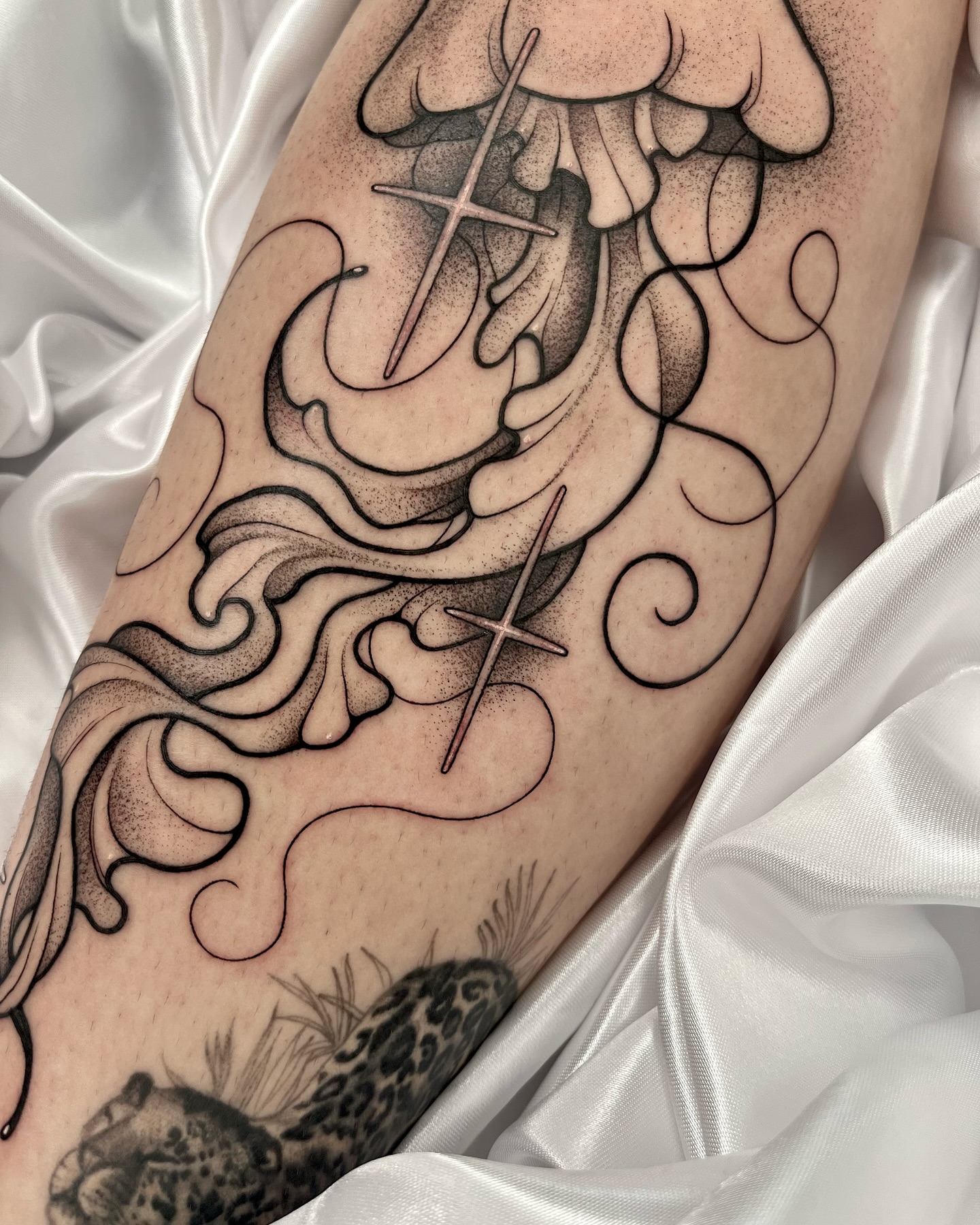 Crosses and swirls dotwork tattoo on the forearm by Gabrieli Folha