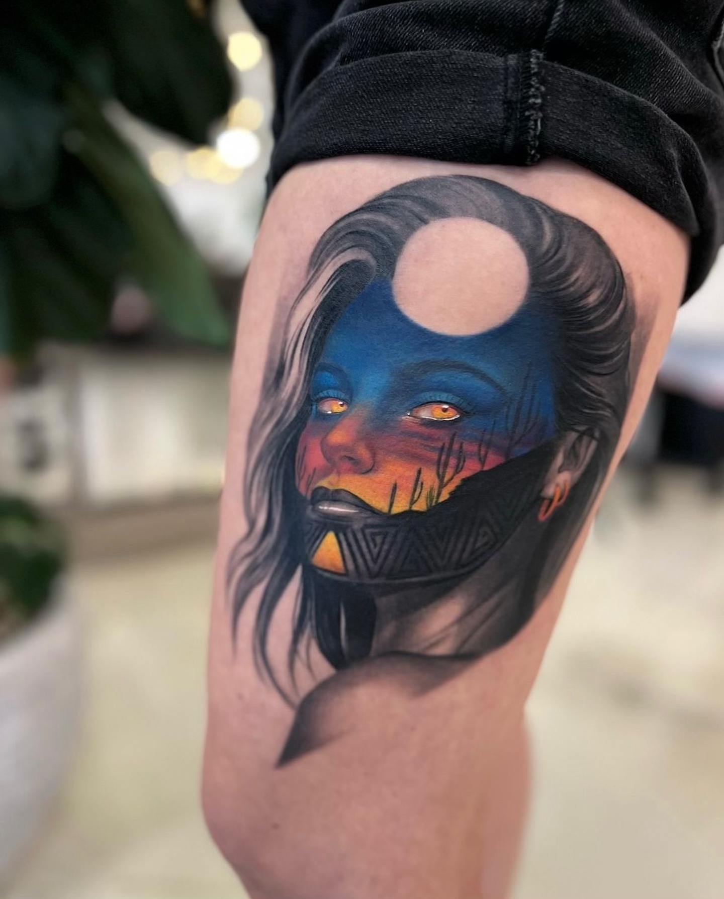 Mask-wearing woman realism tattoo on the thigh by Anthony Michaels, Tucson, Arizona