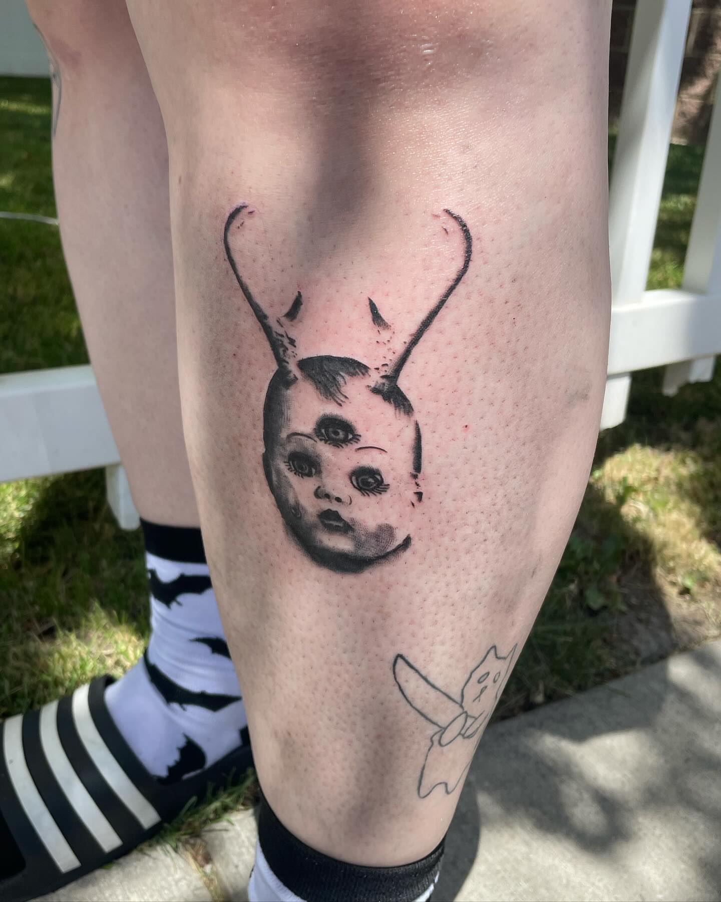 Doll head with antlers dotwork tattoo on the leg by Kaylee 🗡️