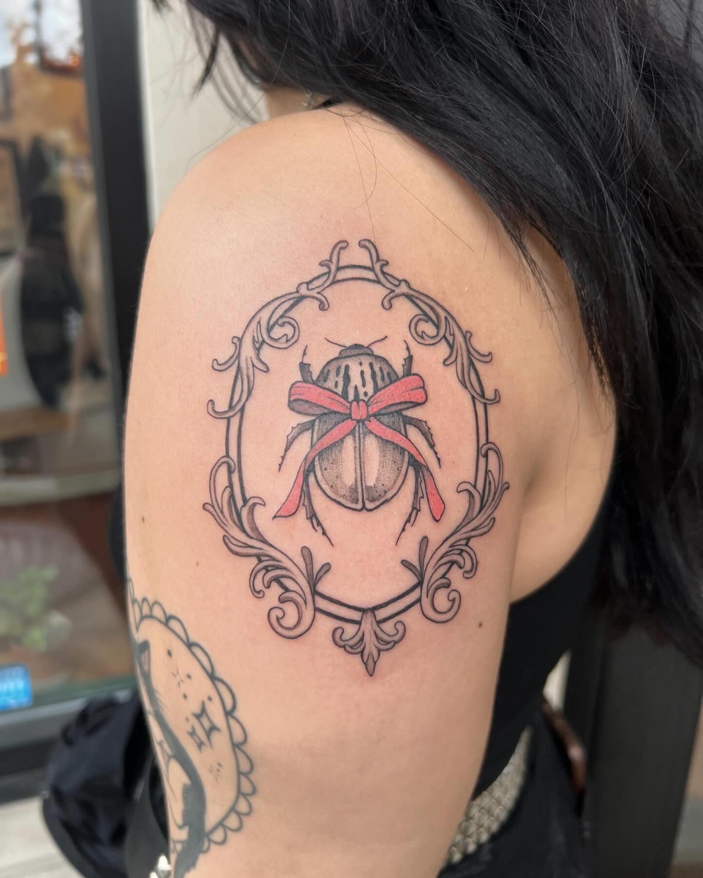 Scarab beetle black and grey tattoo on the shoulder by Tasha Venola, Bellingham, Washington