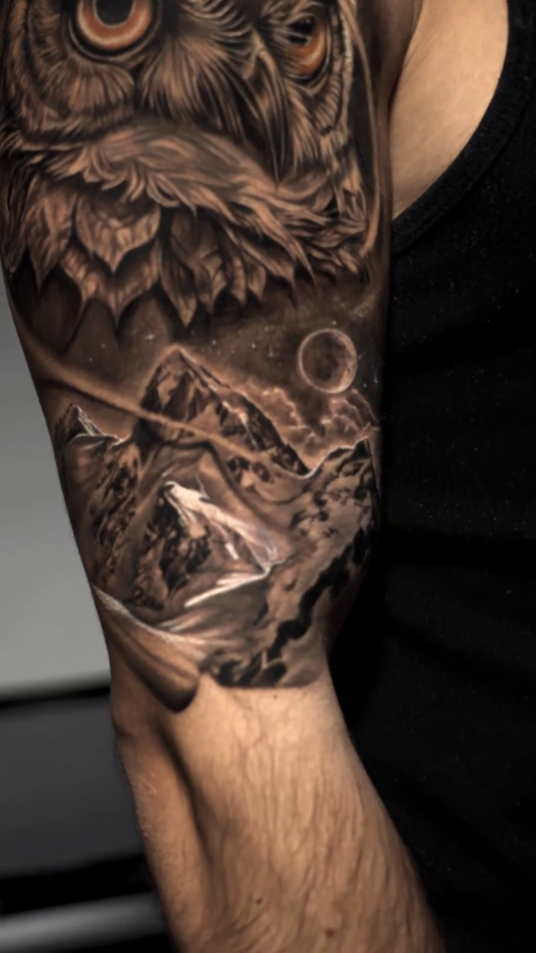 Owl and mountains surrealism tattoo on the forearm by Baxtertattoo
