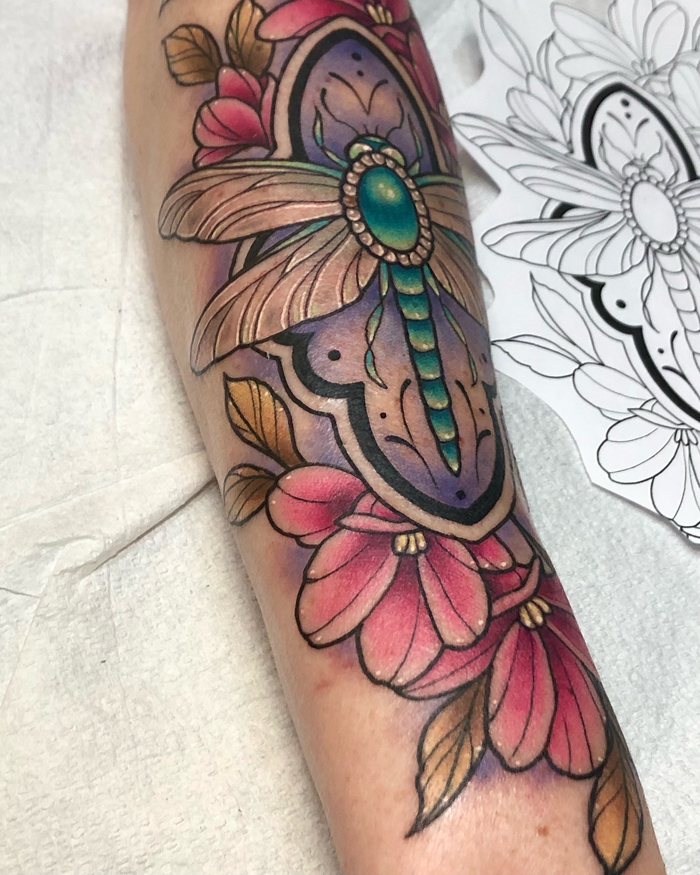 Dragonfly and flowers American traditional tattoo on the forearm by 𝔍𝔢𝔫𝔫𝔦𝔢 𝔗𝔦𝔢𝔰𝔪𝔞𝔫