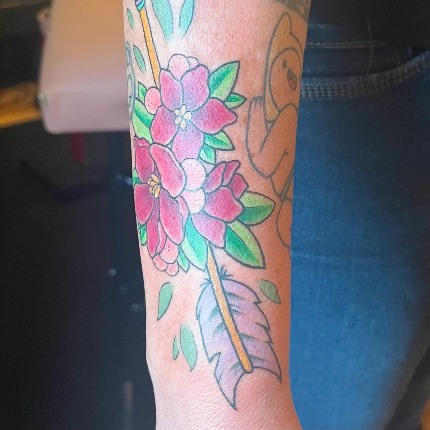 Flowers and feather new school tattoo on the forearm by Krystal ✨