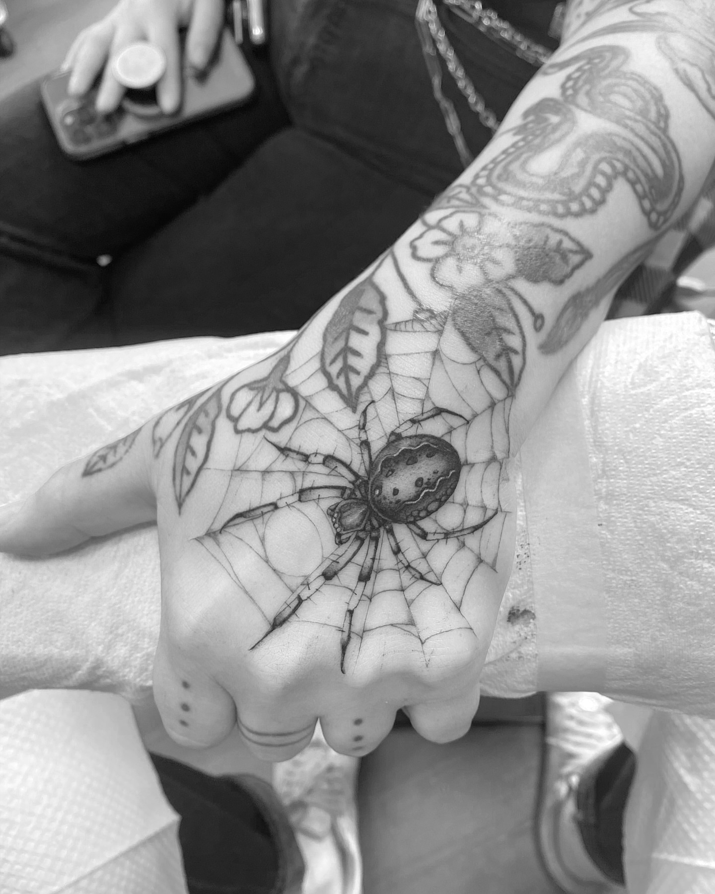 Spider web black and grey tattoo on the hand by Joey Delarosa, San Francisco, California