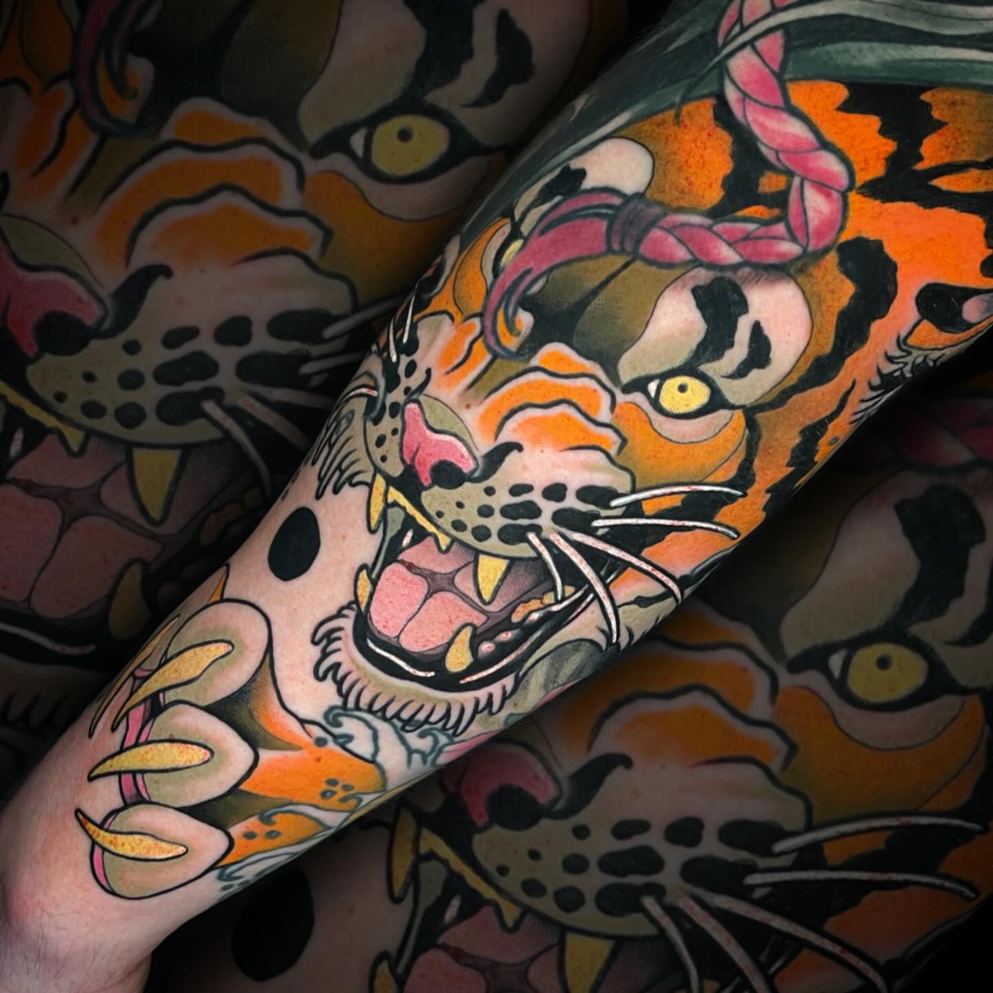 Tiger American traditional tattoo on the forearm by Nathan Mickle