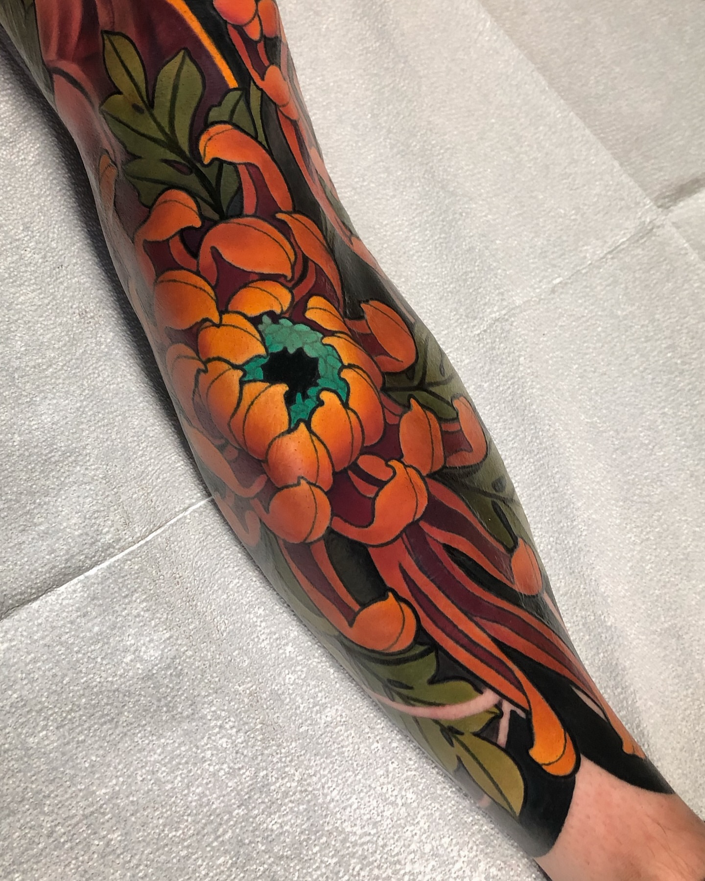 Chrysanthemum japanese irezumi tattoo on the forearm by Milo Alfring Tattoo