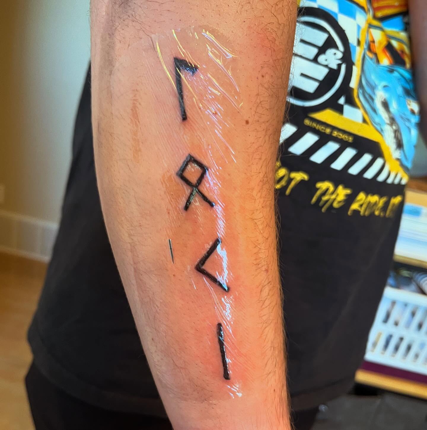 Geometric symbols geometric tattoo on the forearm by Val Maughan