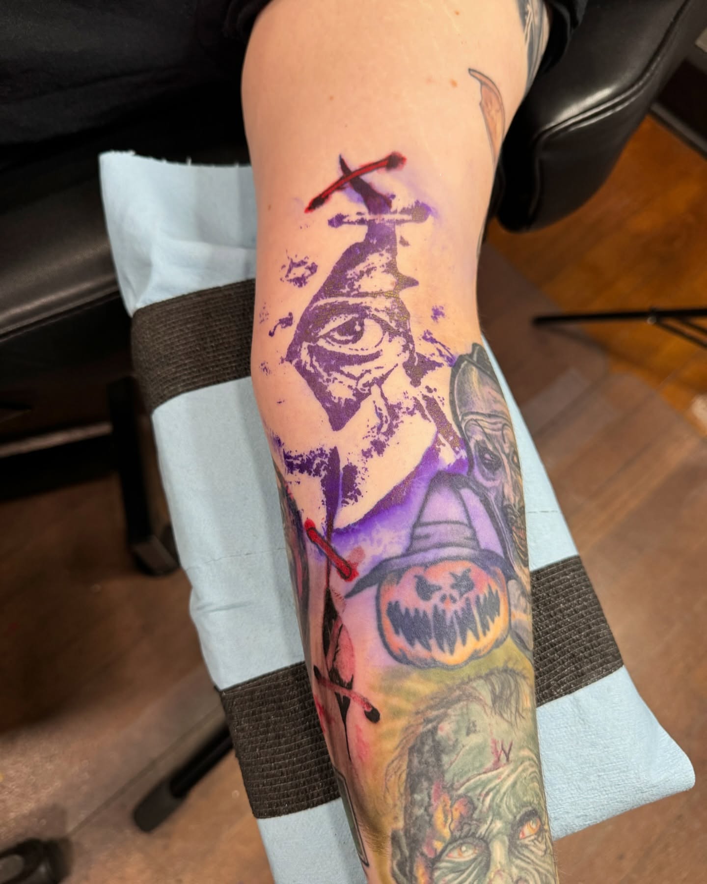 Eye and pumpkin watercolor tattoo on the forearm by Izak Blanke, Murfreesboro, Tennessee
