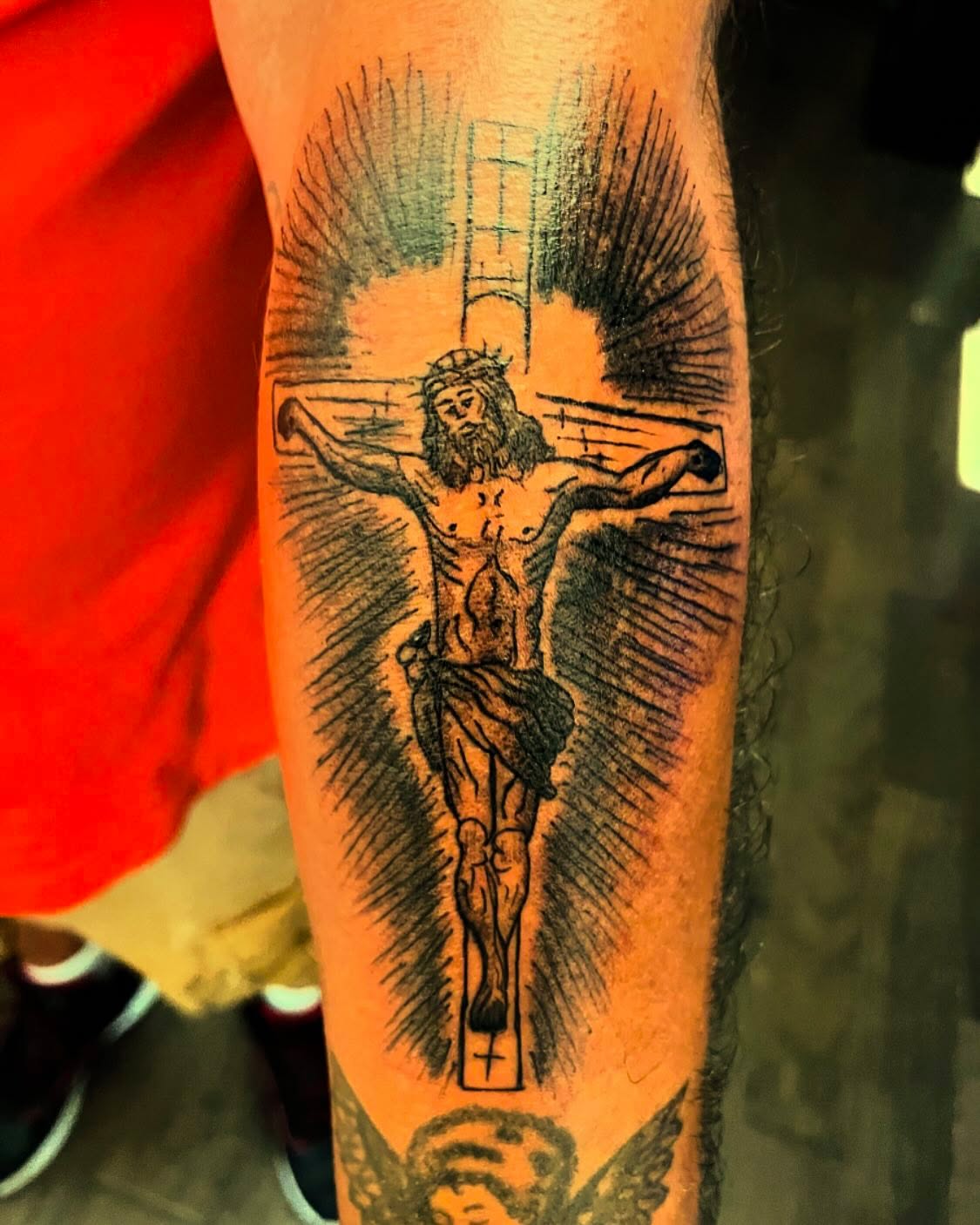 Crucifixion scene black and grey tattoo on the forearm by Anna DeLuna