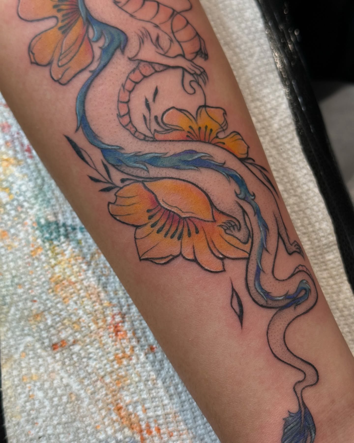 Serpent and flowers new school tattoo on the forearm by Hailey K - Arizona Tattoo Artist, Miami, Florida
