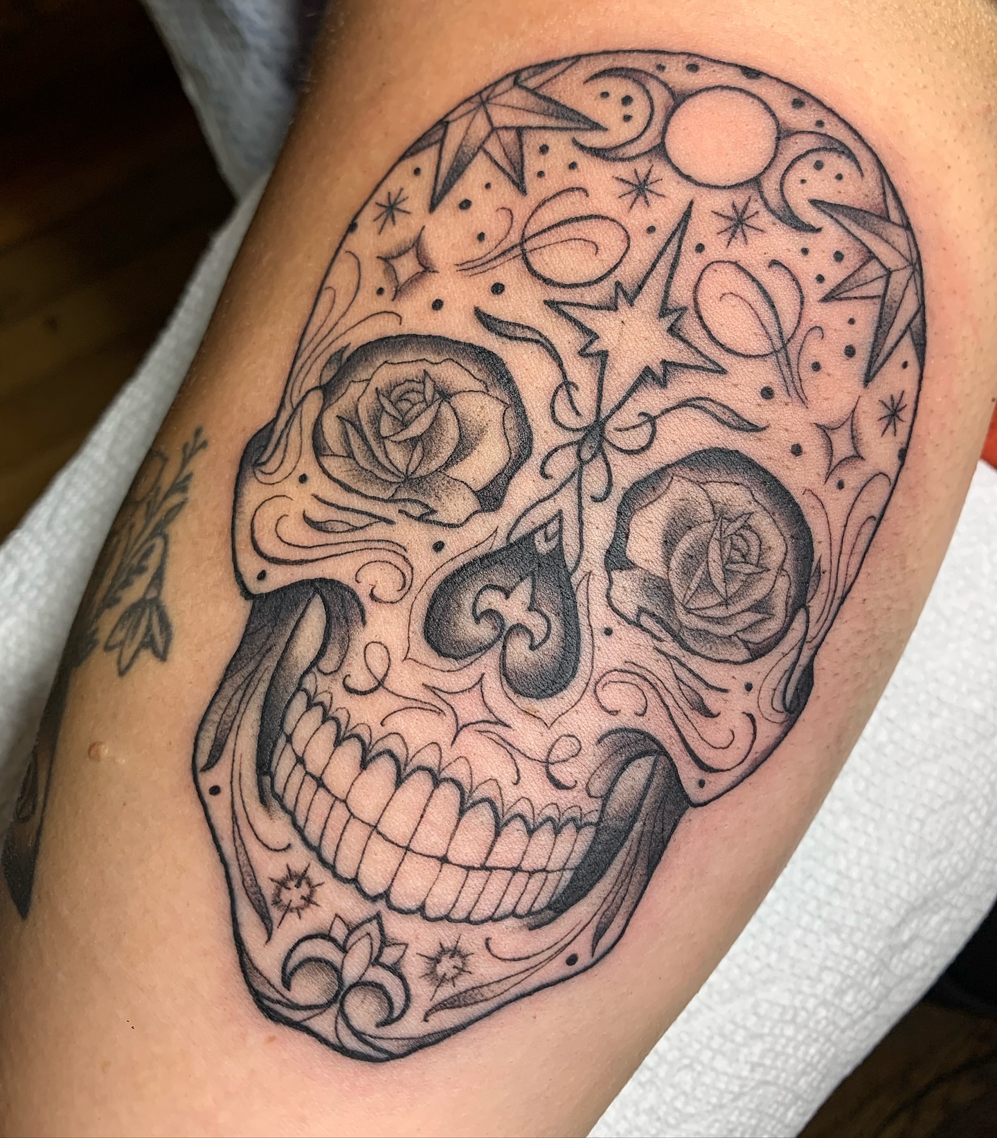 Sugar skull black and grey tattoo on the forearm by ATLANTA Queer Tattooer