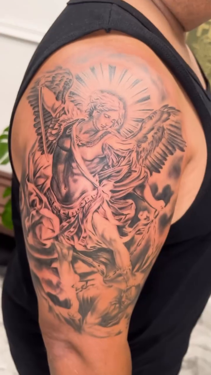 Angelic figure with rays of light realism tattoo by Sloe Rivera