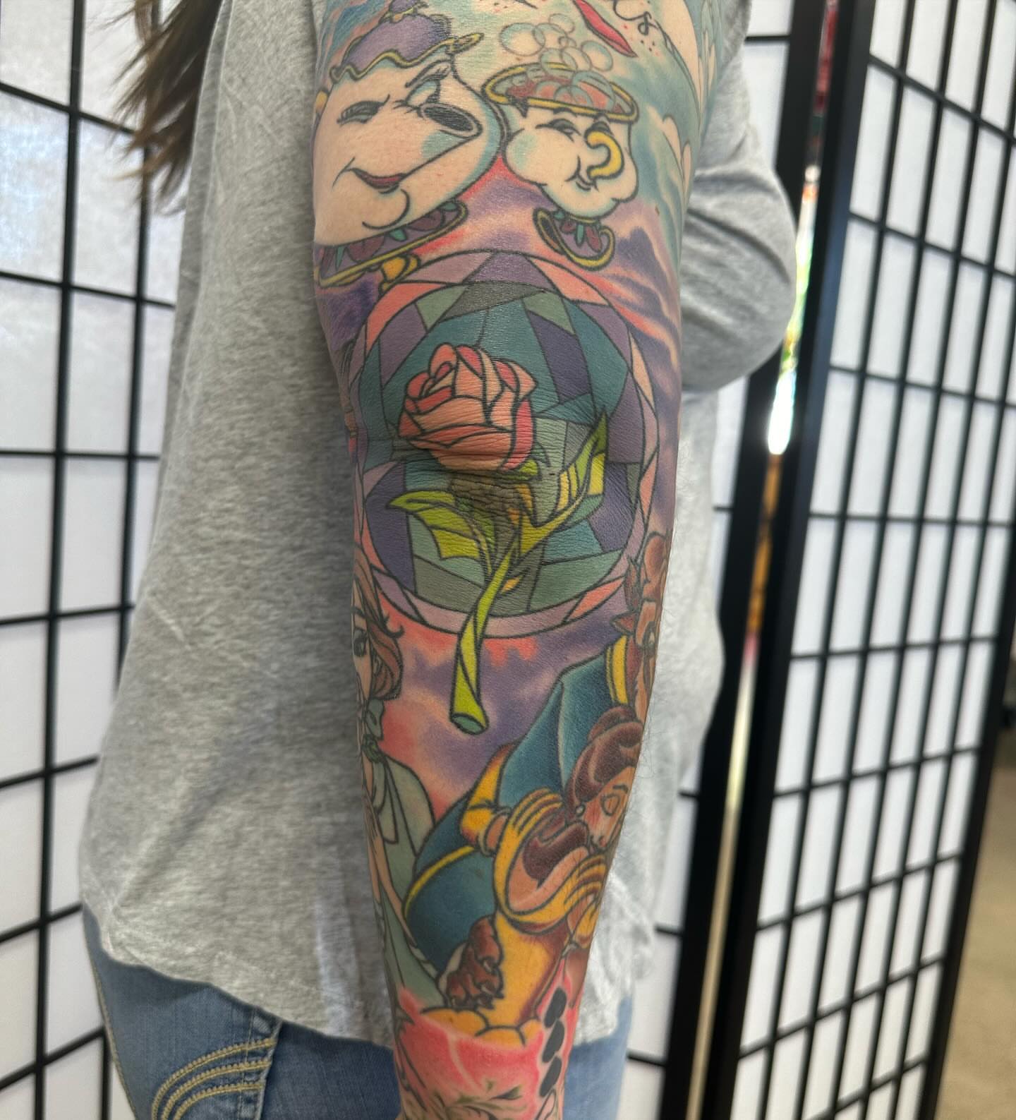 Beauty and the beast new school tattoo on the forearm by Dave G