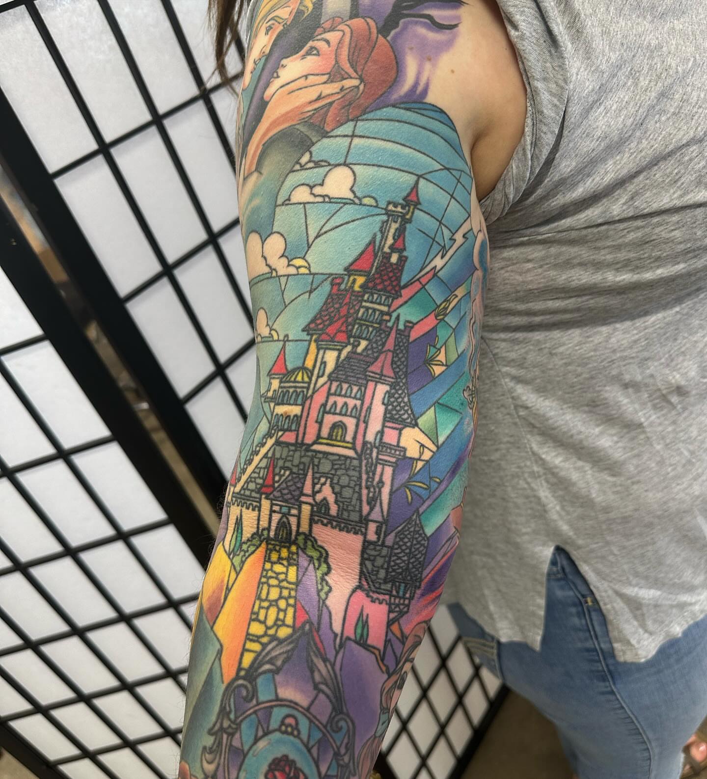 Castle and fairy tale characters new school tattoo on the forearm by Dave G