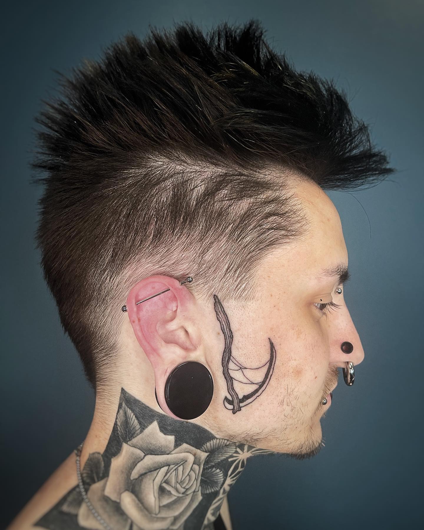 Rose black and grey tattoo on the neck by Bryan Black