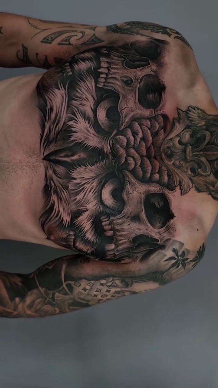 Skull and floral elements dark realism tattoo by Nathan Mathers Tattooist