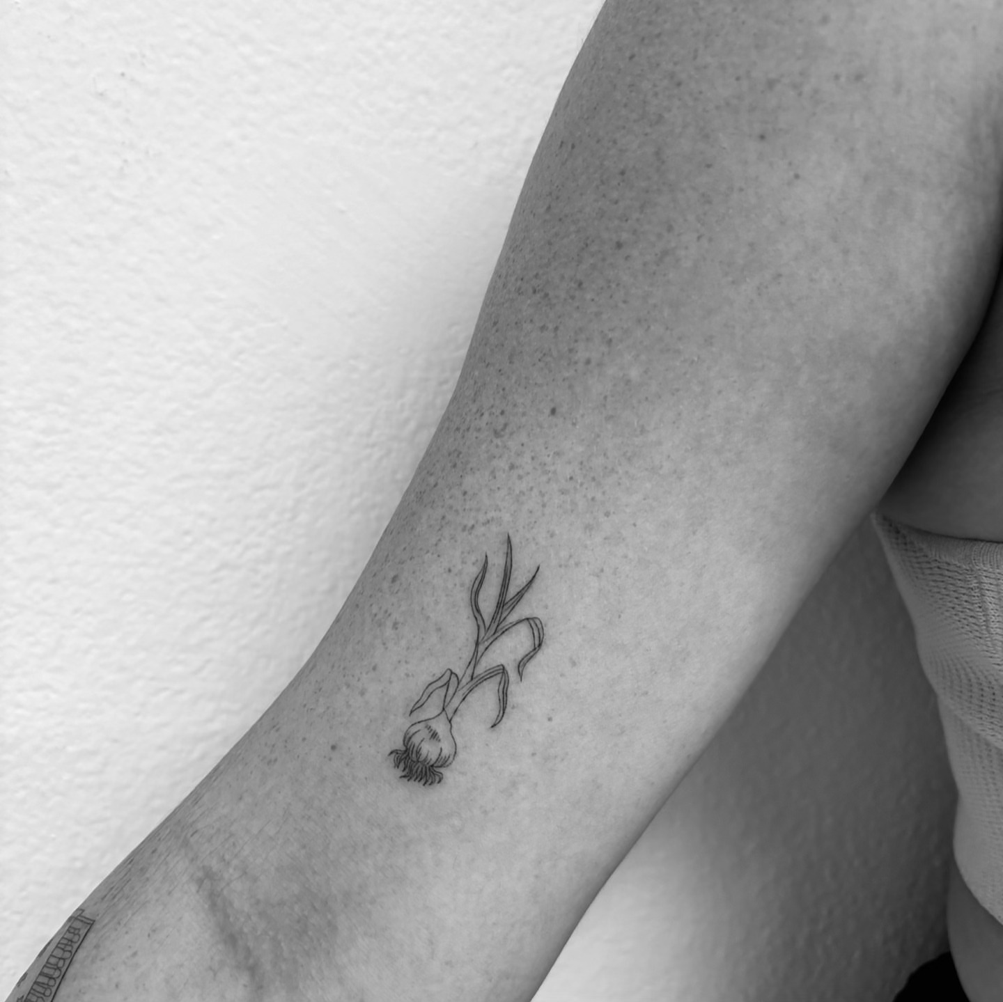 Flower black and grey tattoo on the forearm by Mady