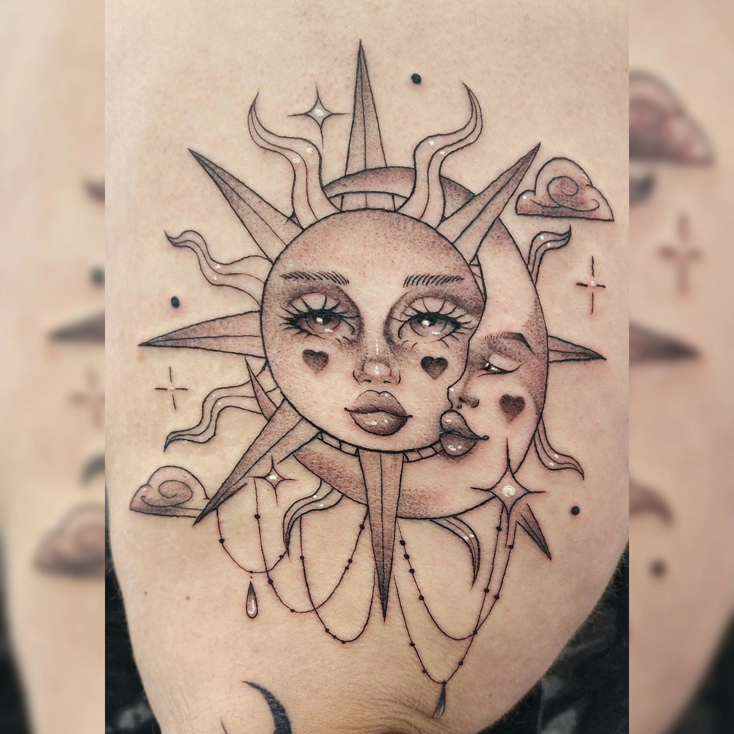 Sun and moon faces dotwork tattoo on the forearm by Diane Maya