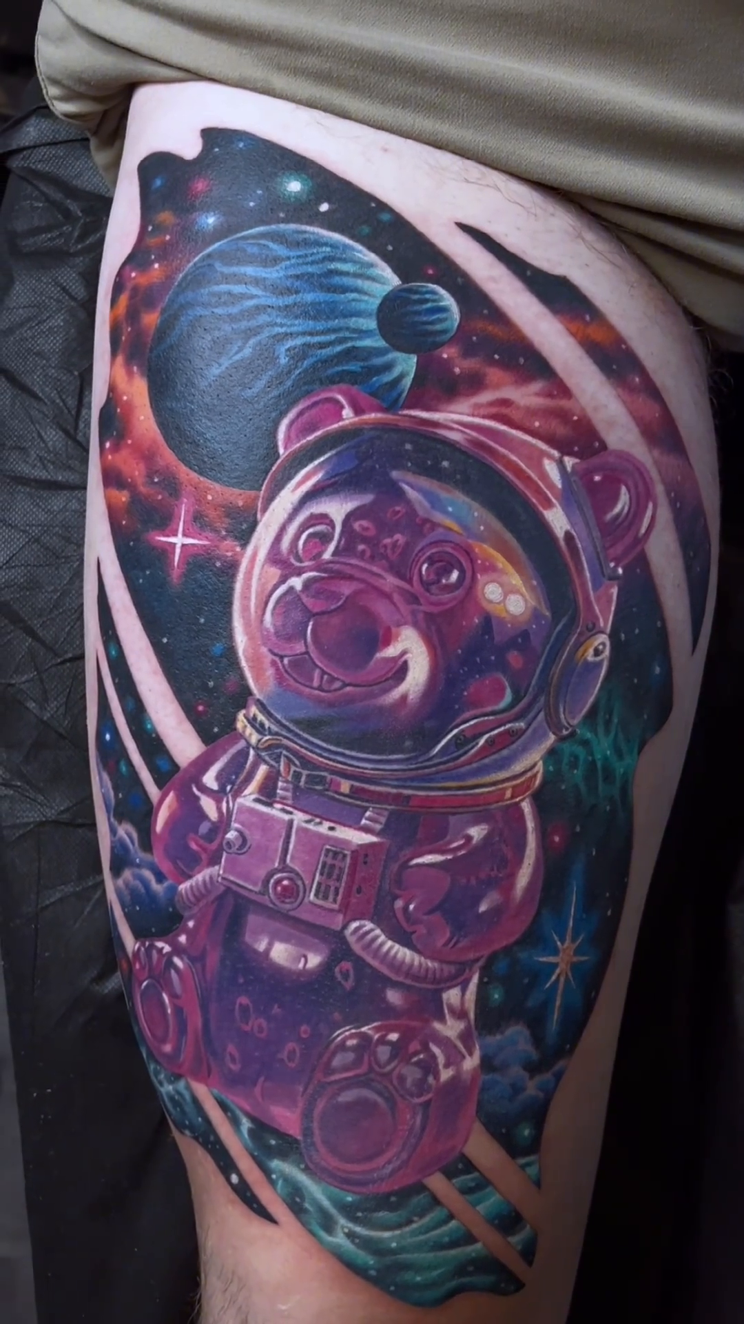 Astronaut gummy bear in space realism tattoo by Walt Watts, Salt Lake City, Utah