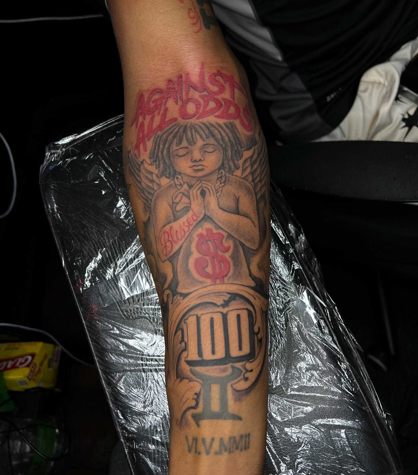 Praying angel American traditional tattoo on the forearm by JT Ink