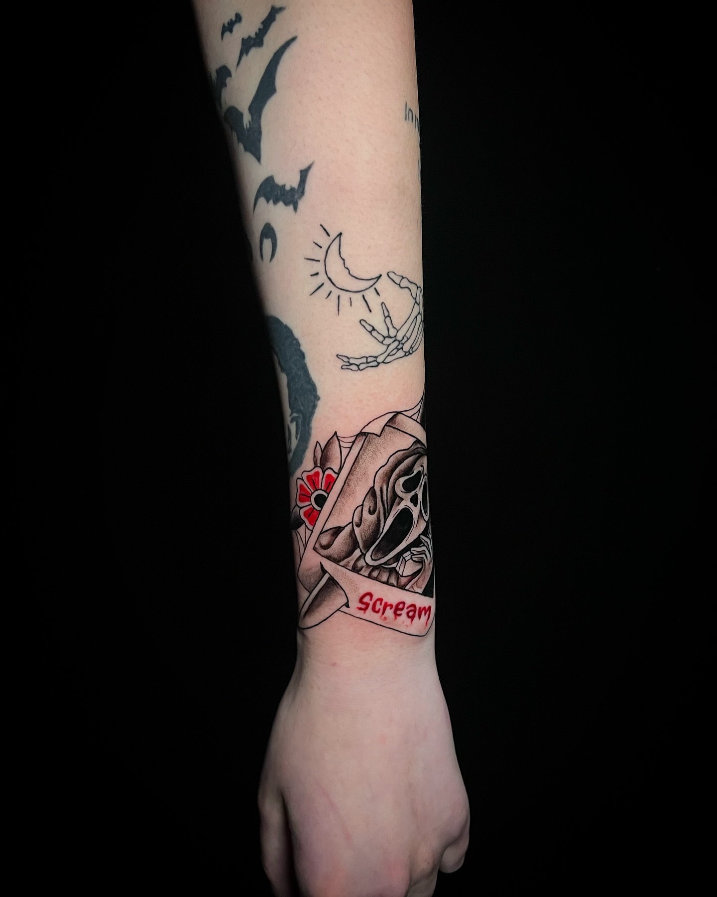 Skull and rose American traditional tattoo on the forearm by MoogieTats
