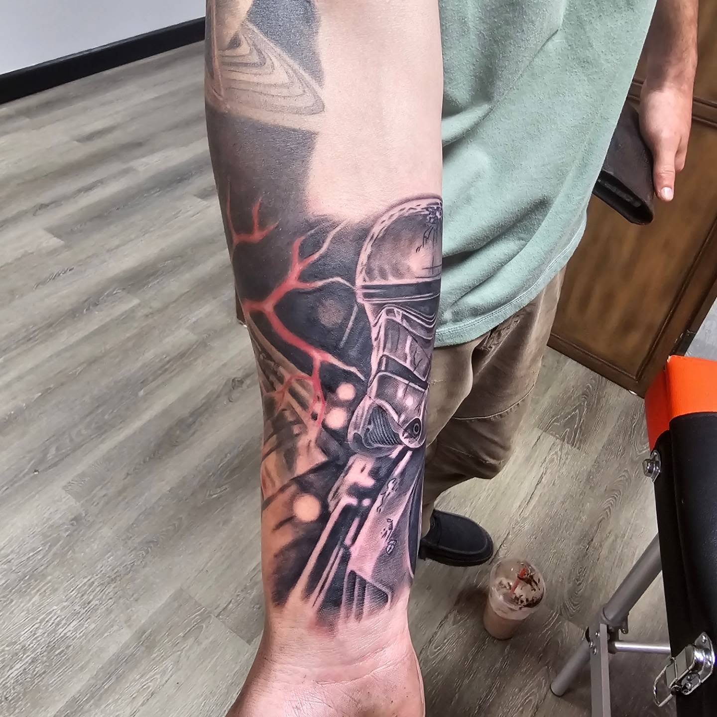 Cyborg hand realism tattoo on the forearm by Gene Britton