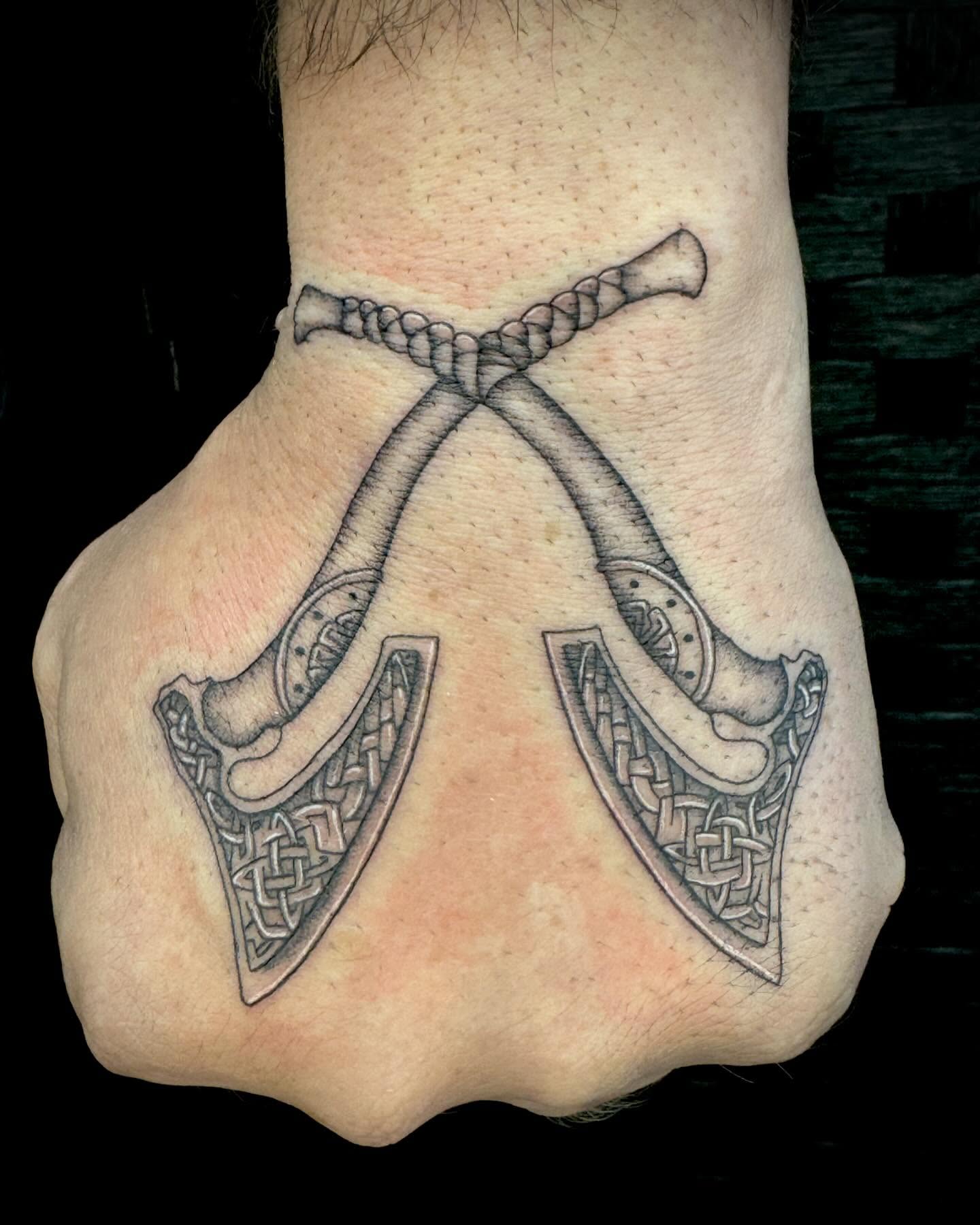 Crossed axes geometric tattoo on the hand by oh hey, robin.
