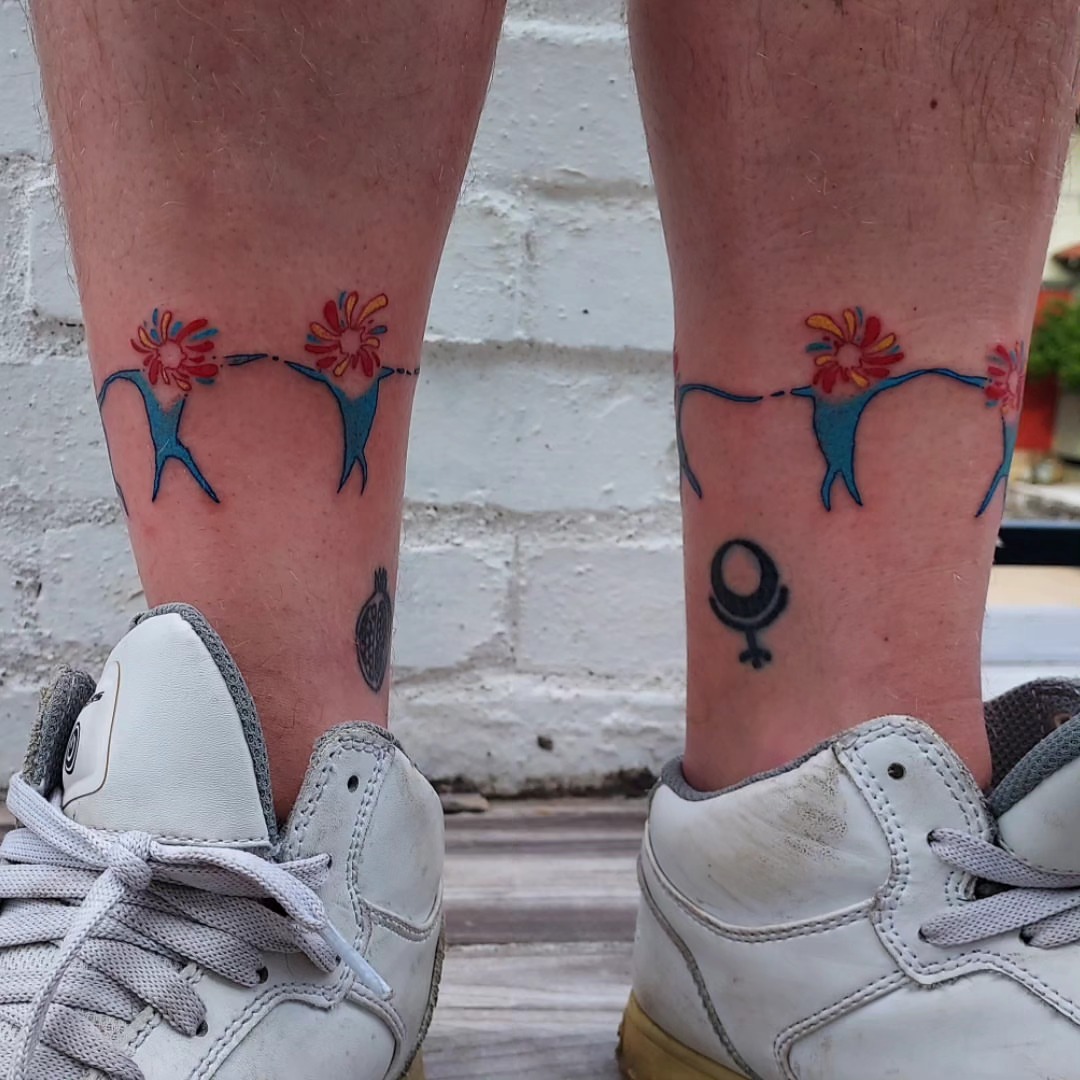 Female figures with flowers neo-traditional tattoo on the calf by Spike Cameron