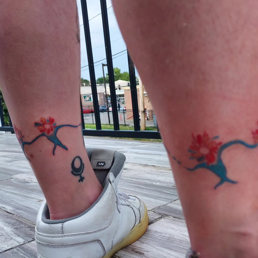 Bird and flower new school tattoo on the leg by Spike Cameron