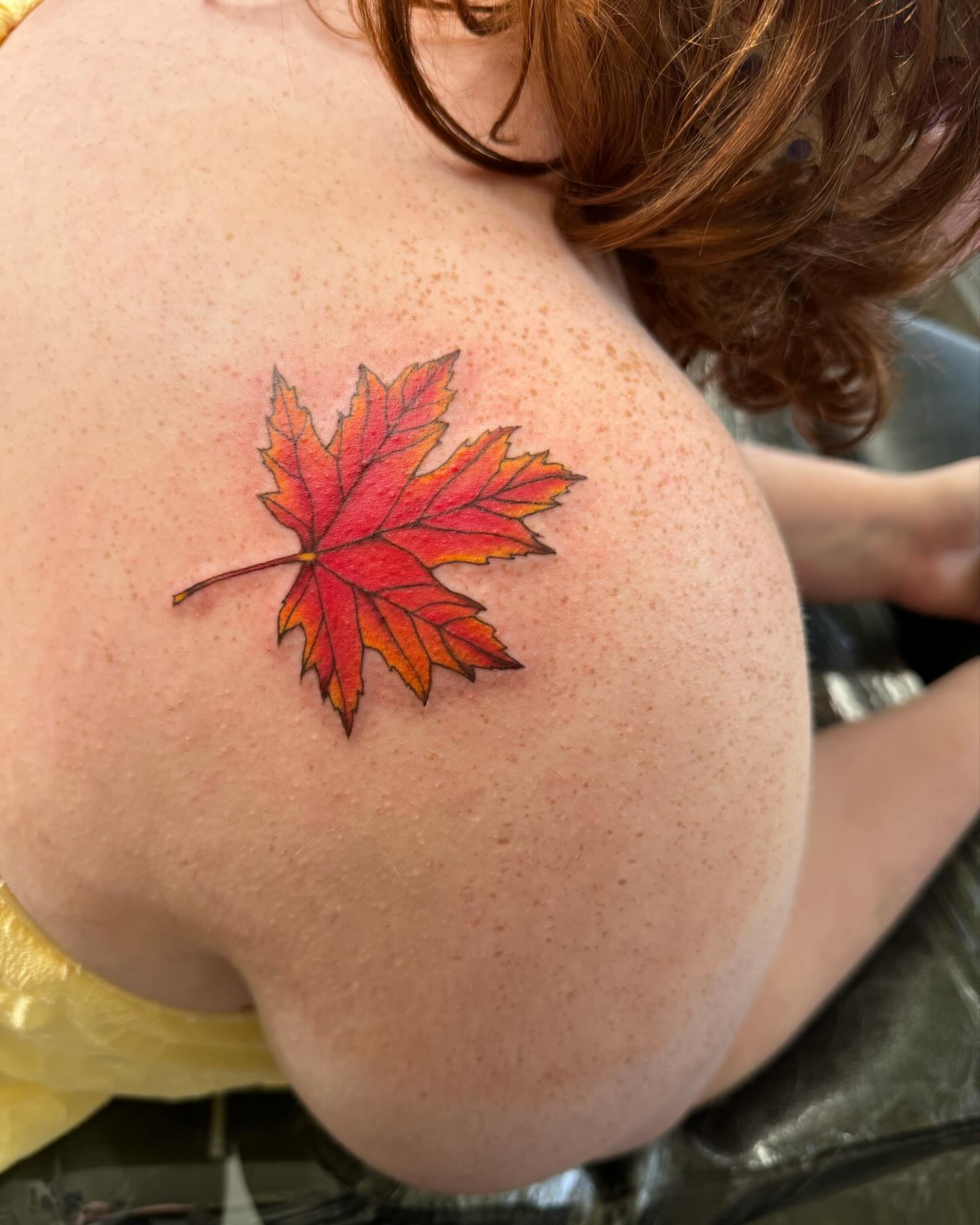 Maple leaf realism tattoo on the shoulder by Robyn Mahon