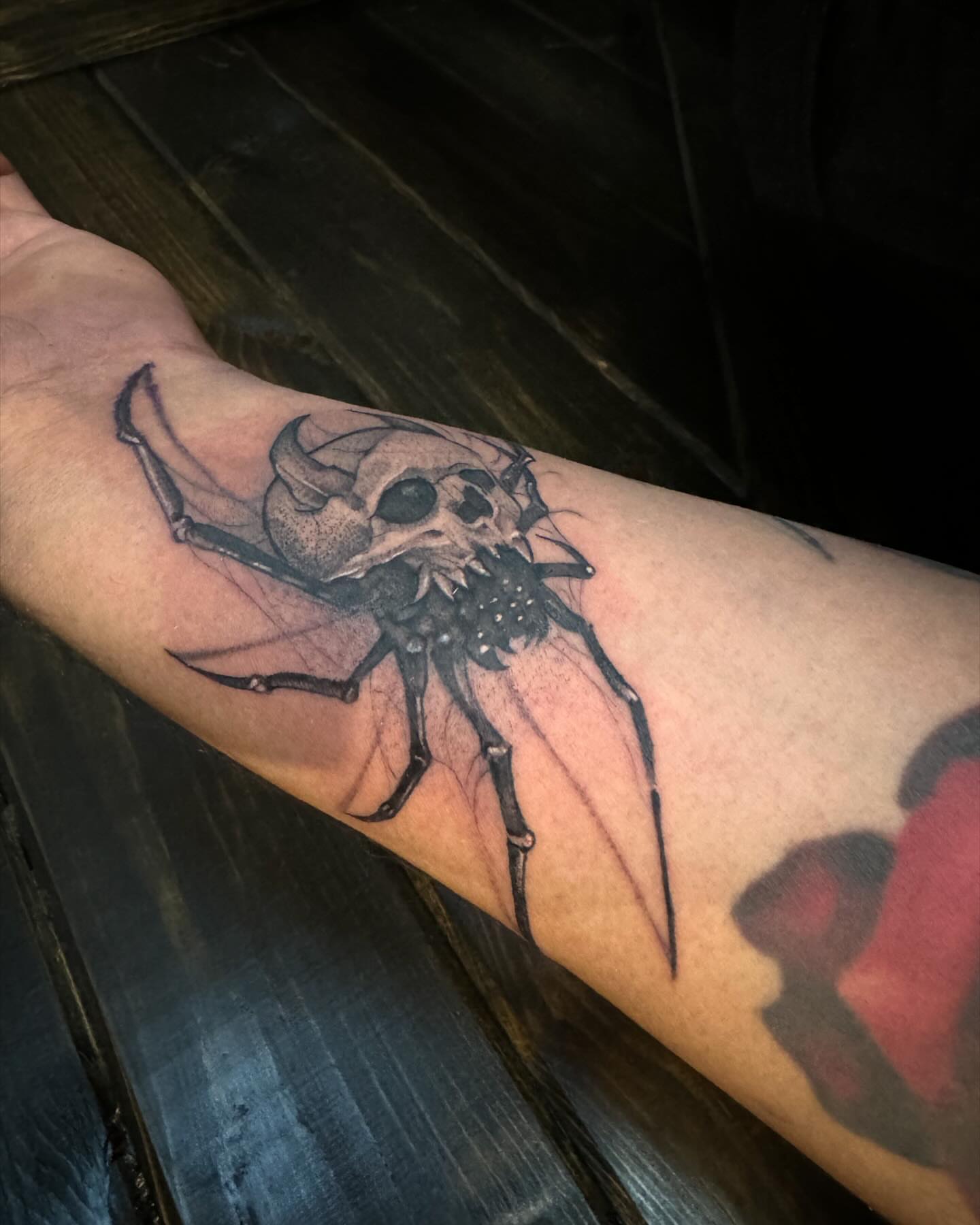Skull spider dark realism tattoo on the forearm by Bernie calderon, Fresno, California