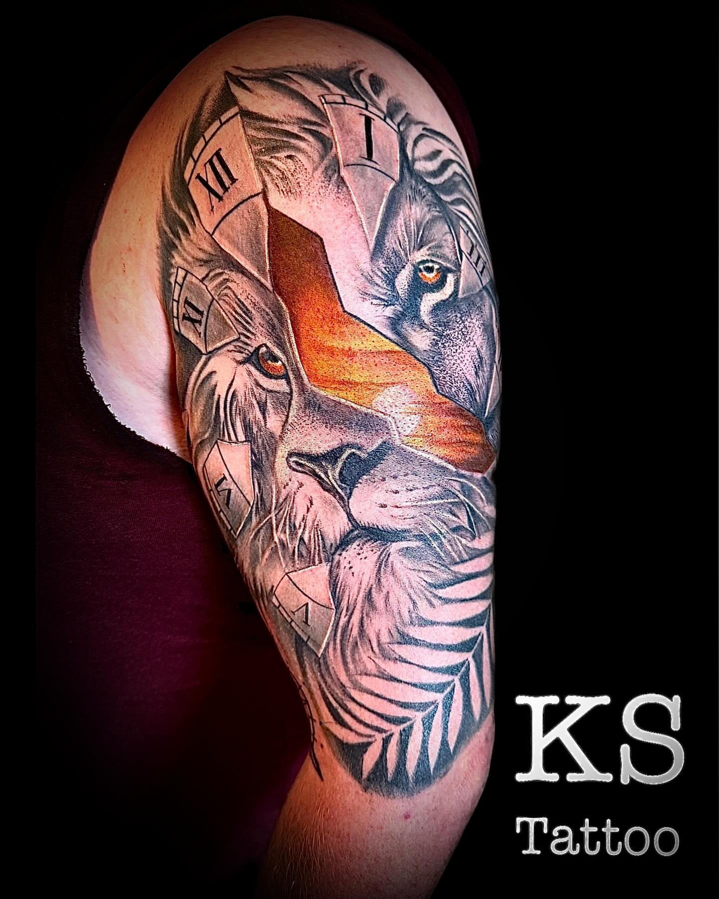 Lion and wolf realism tattoo on the forearm by Karen Smith