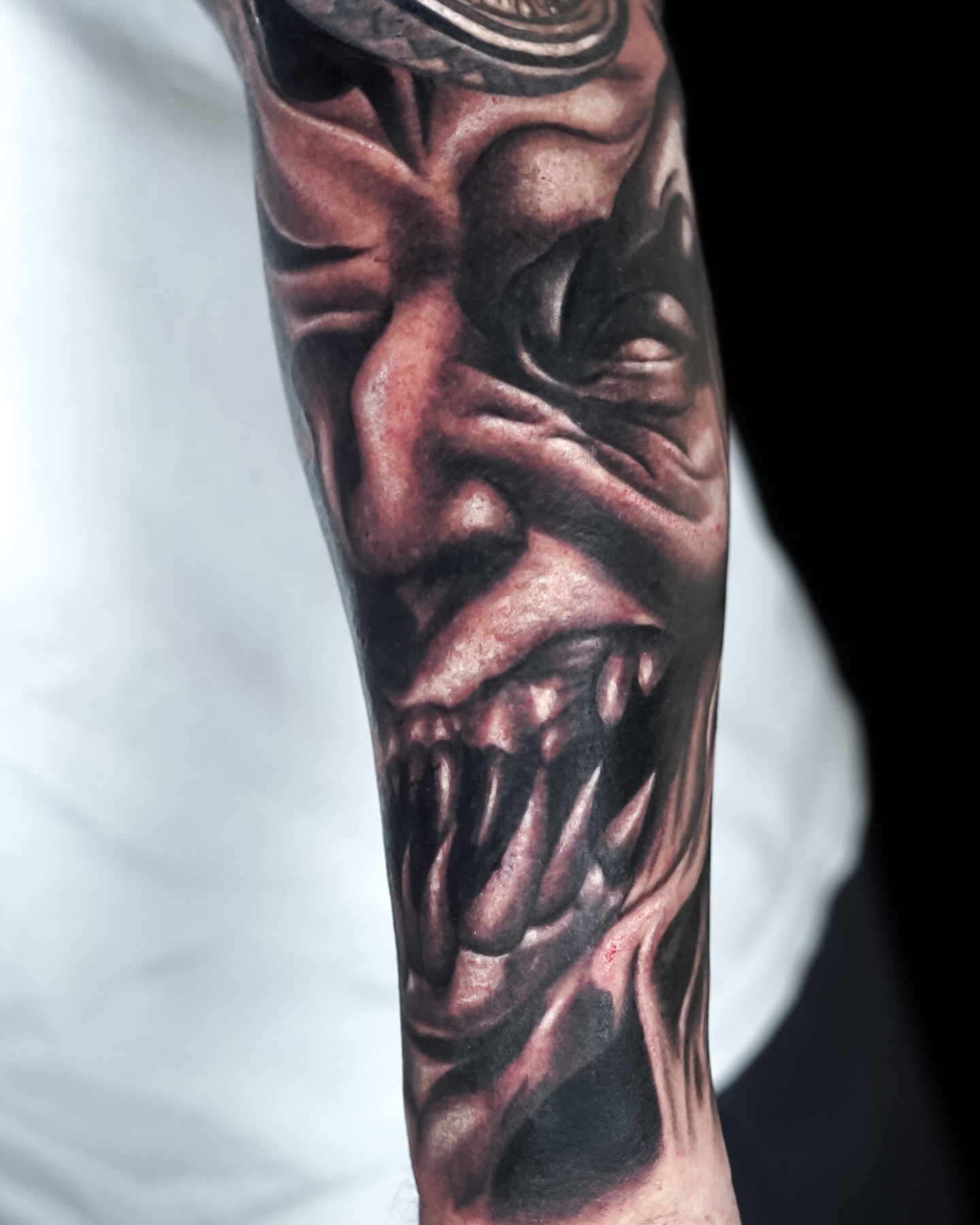 Demon face dark realism tattoo on the forearm by ✝️ Nicholas Fernandez ✝️