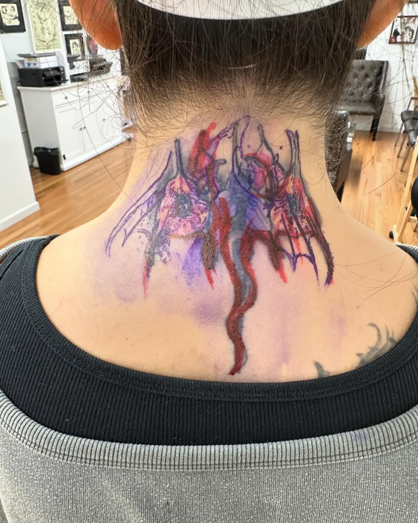 Abstract watercolor watercolor tattoo on the neck by ⠀Joey Rosado