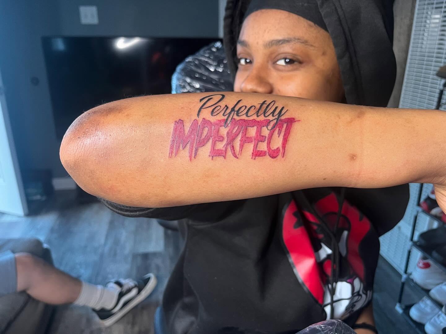 Perfectly Imperfect lettering script tattoo on the forearm by Bris