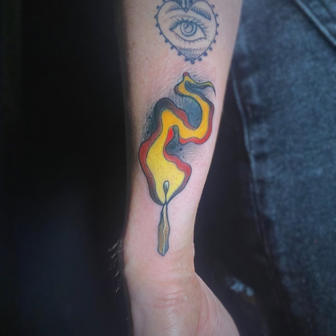 Flame new school tattoo on the forearm by Brian Overholt